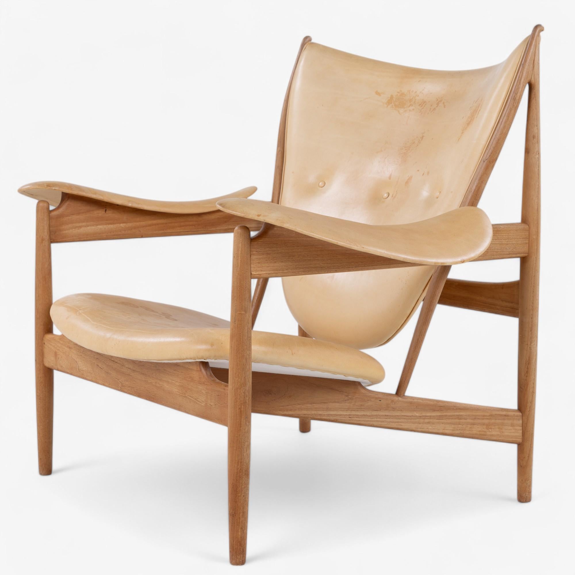 NV 49 'Chieftain' lounge chair in solid teak with patinated leather. Designed in 1949 by Finn Juhl.