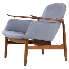 NV 53 - Armchair in walnut by Finn Juhl