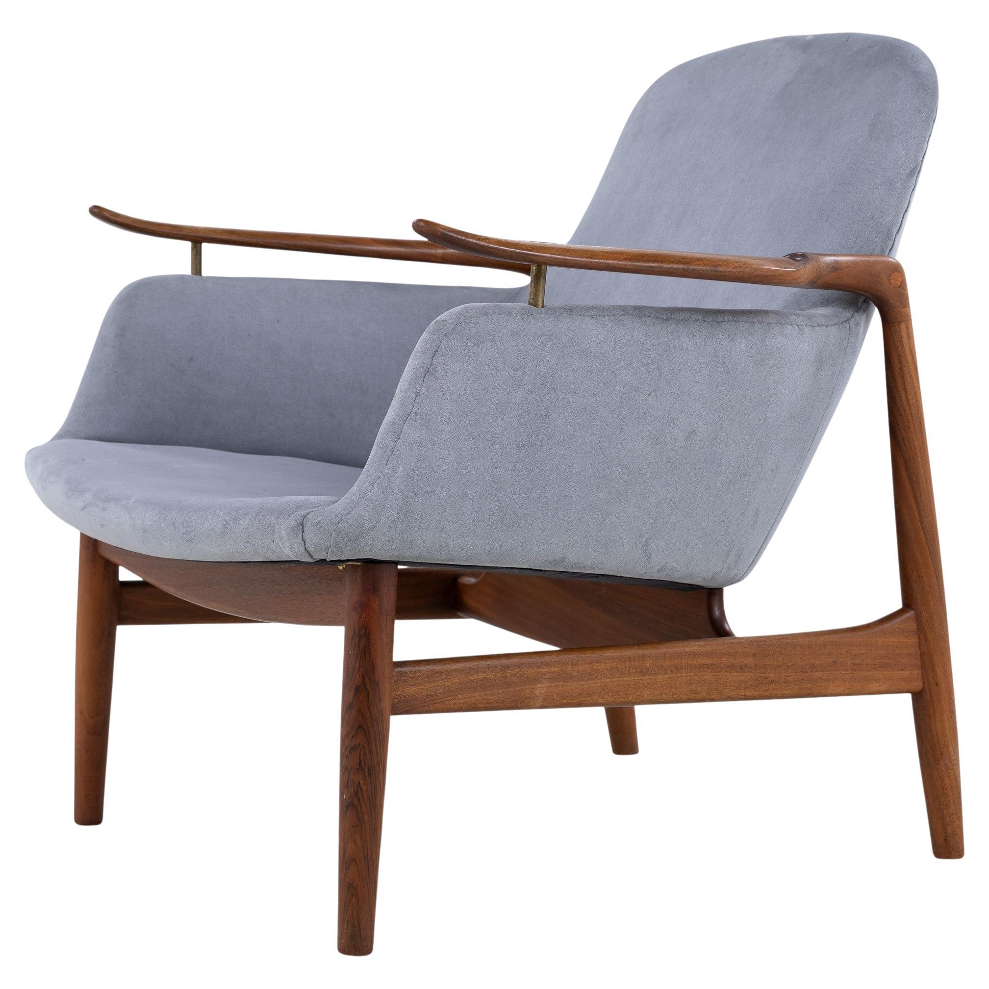 NV 53 - Armchair in walnut by Finn Juhl