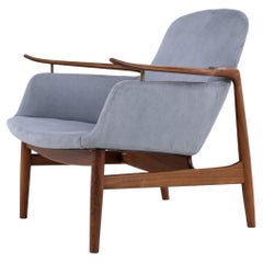 NV 53 - Armchair in walnut by Finn Juhl