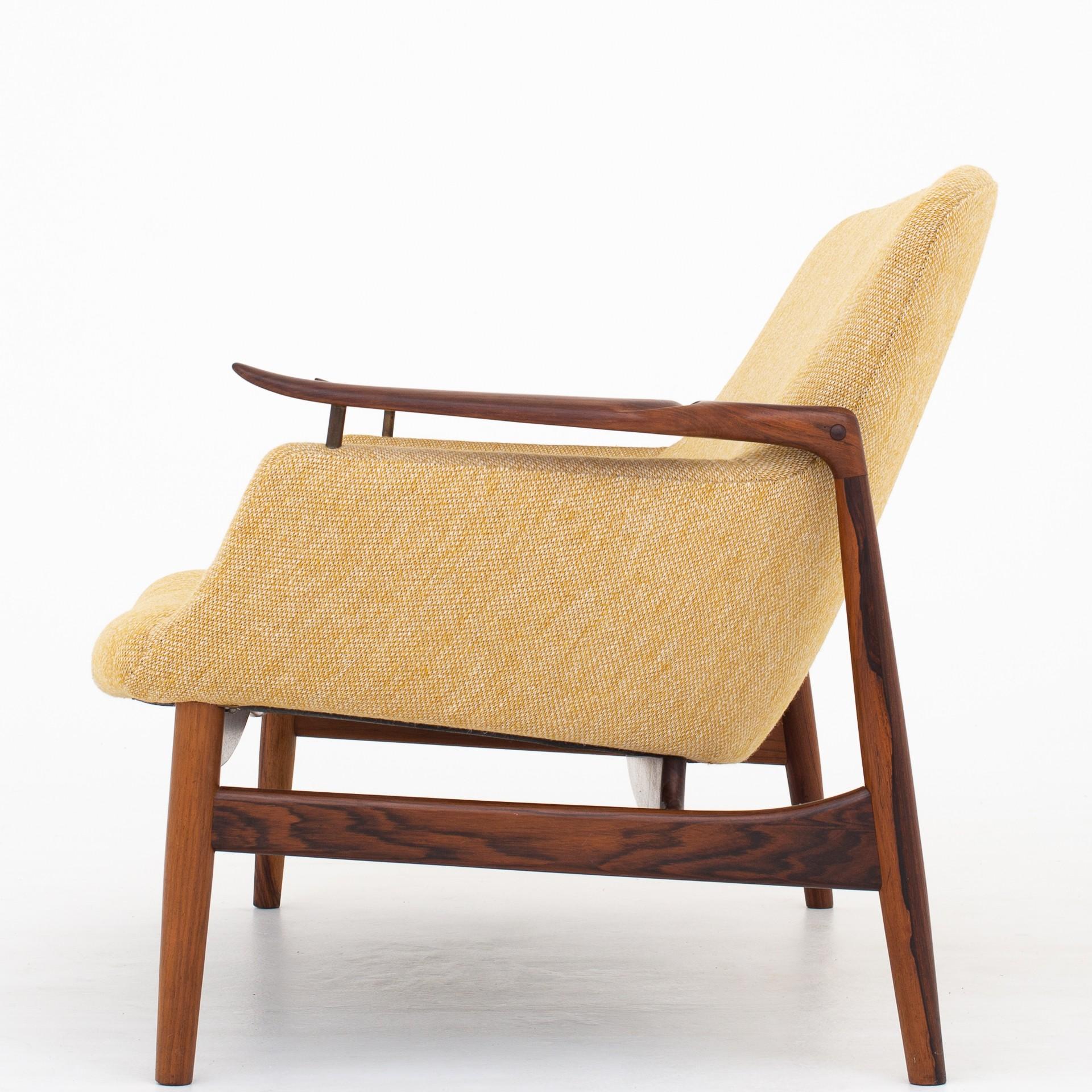 NV 53/2 - Two-seat sofa in rosewood, reupholstered in yellow wool. Maker Niels Vodder. Design 1953.