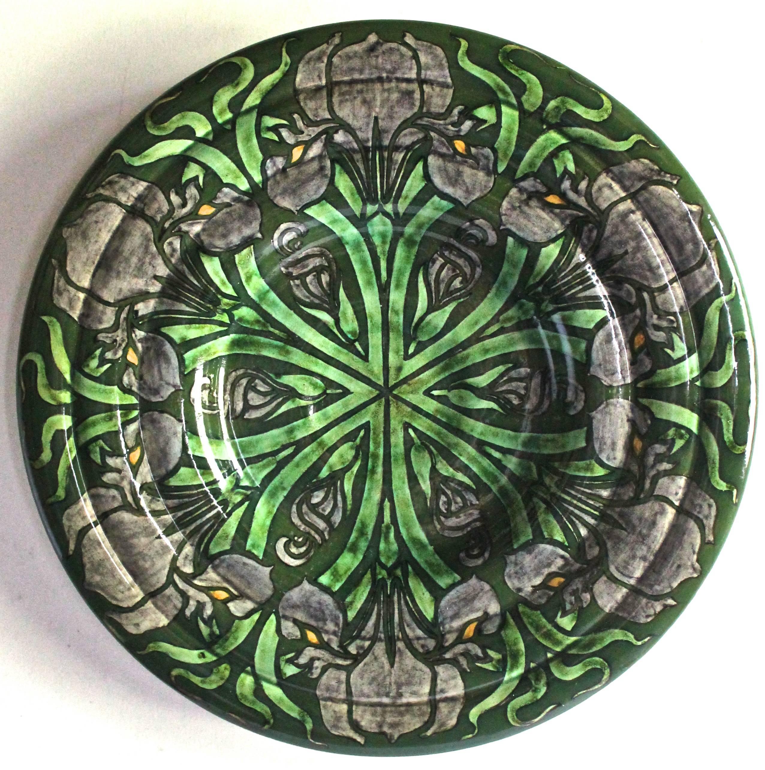 A large and unique hand-painted decorative wall plate. Designer unknown but marked with a WM.