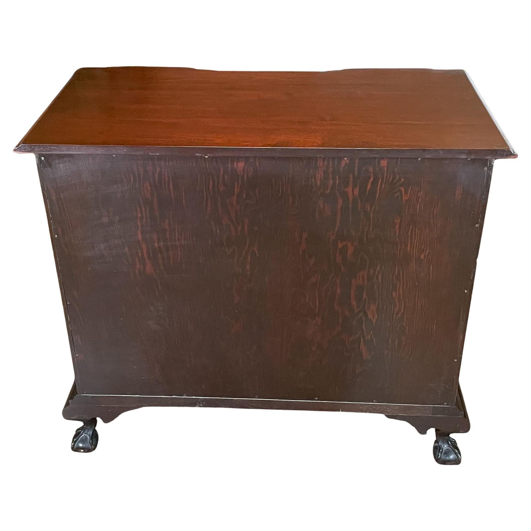 A vintage Mahogany Ball and Claw Blockfront Chest of Drawers brought to you by Niagara Furniture. A classic furniture style this blockfront shaped chest features four drawers which are each beautifully shaped and carved to  work together creating a