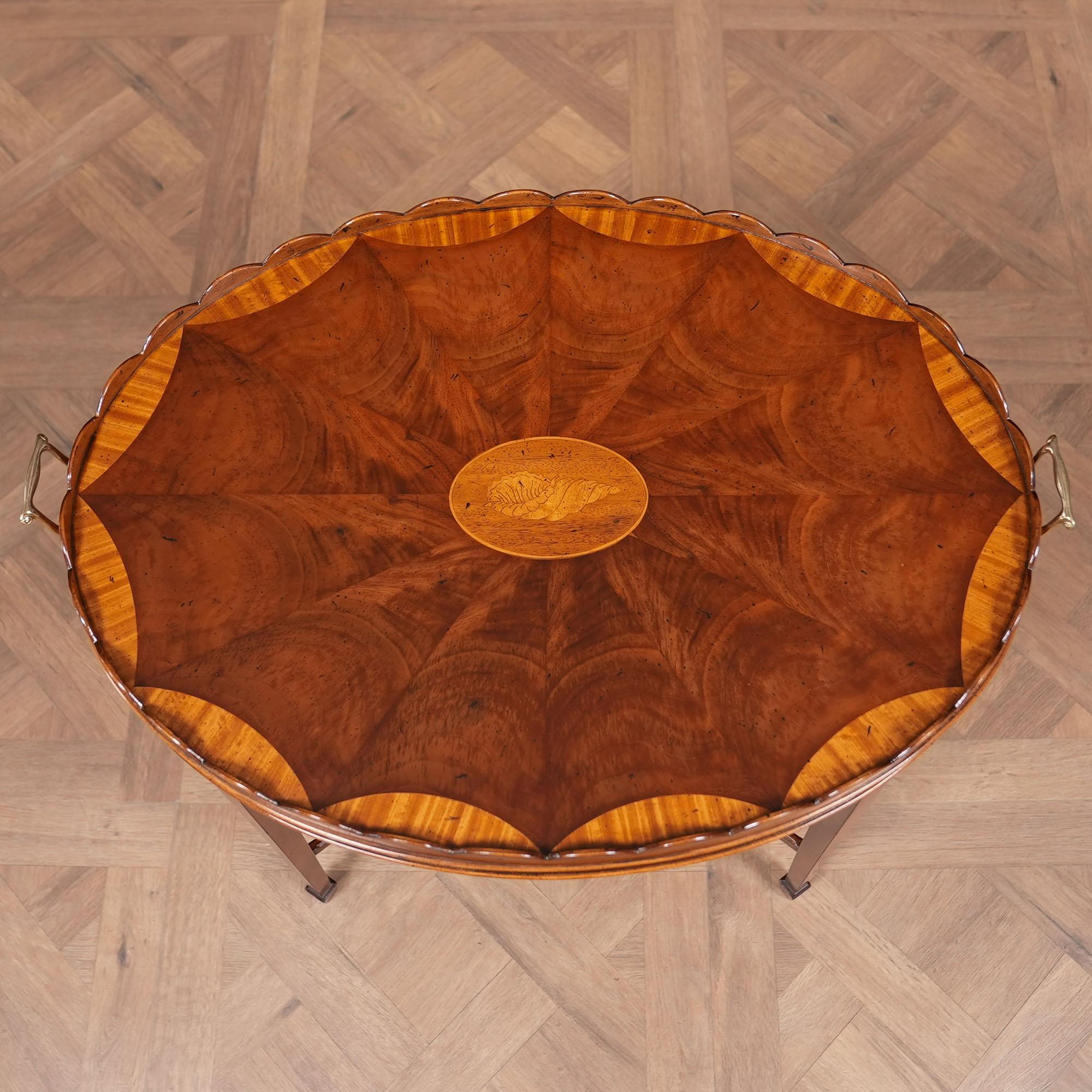 A great quality piece of furniture this Vintage Baker Serving Table will be the focal point of any area in your home. From the beautiful inlaid top with elegant brass handles to the sturdy and elegantly shaped base everything on this table works