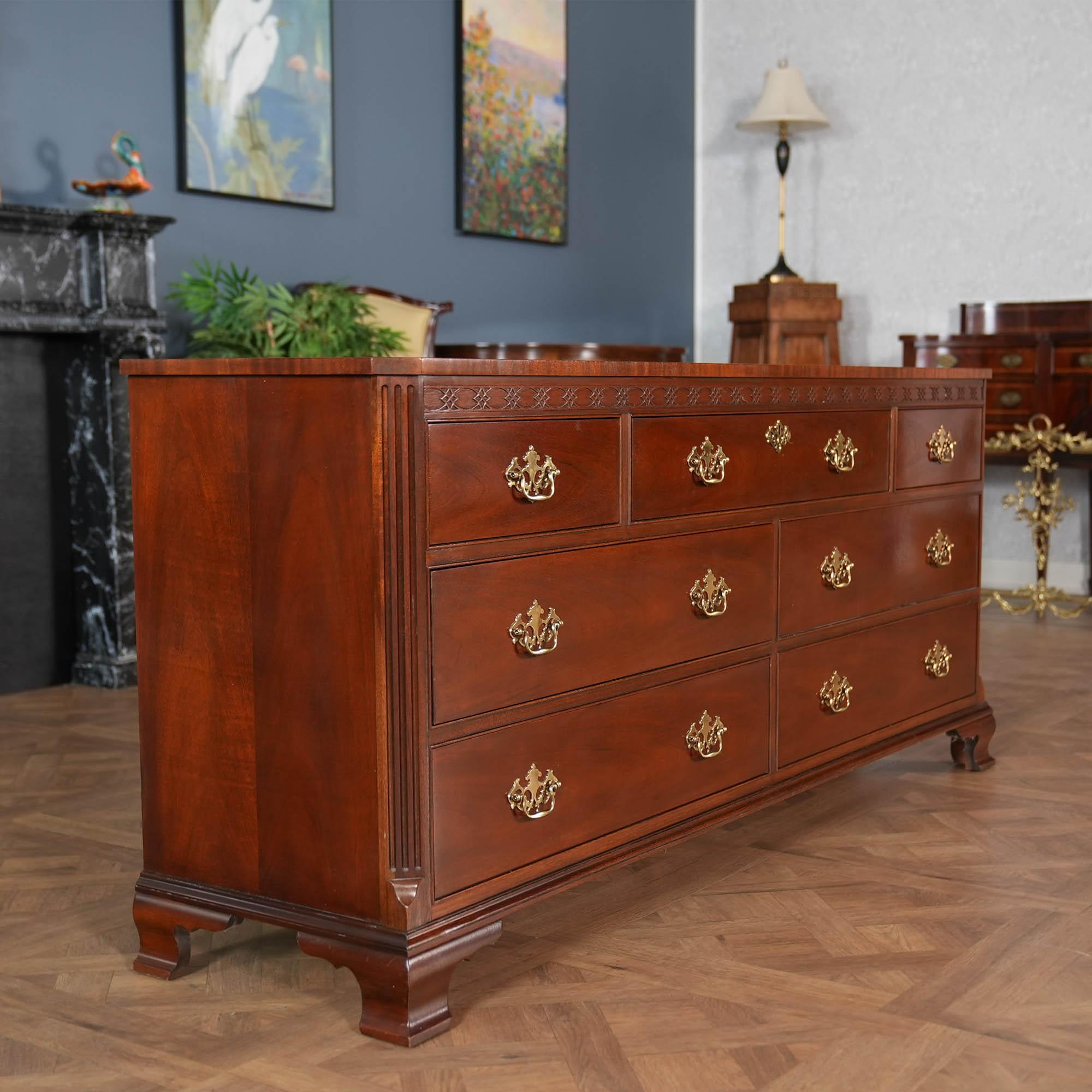A Vintage Baker Mahogany Triple Dresser brought you by Niagara Furniture. A classic furniture shape this chest features three drawers  across the top section and two rows of two drawers below to give this large dresser an elegant and traditional