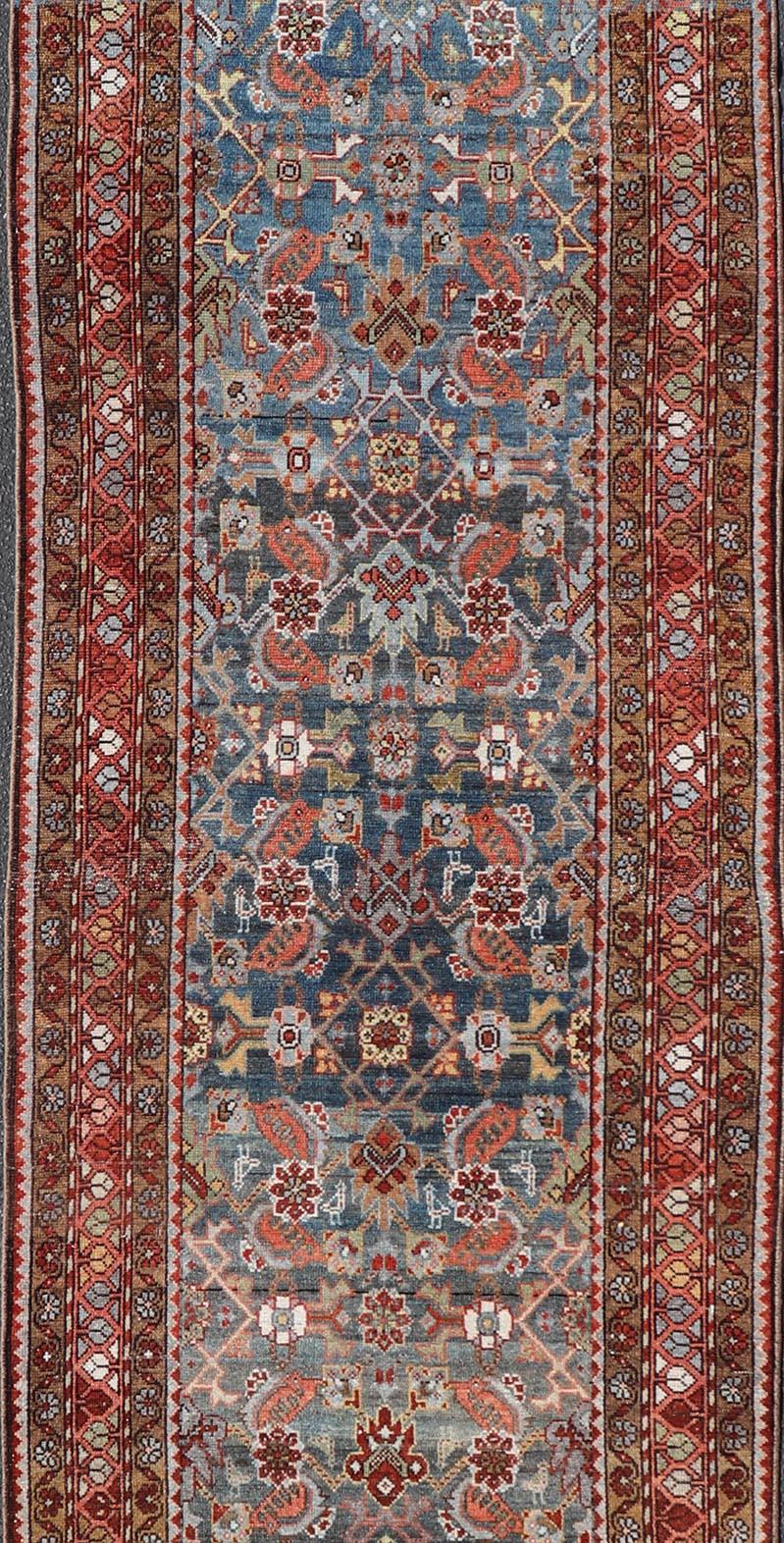 Heriz Serapi N.W. Persian Antique Runner with Geometric Florals Set on a Blue Field For Sale