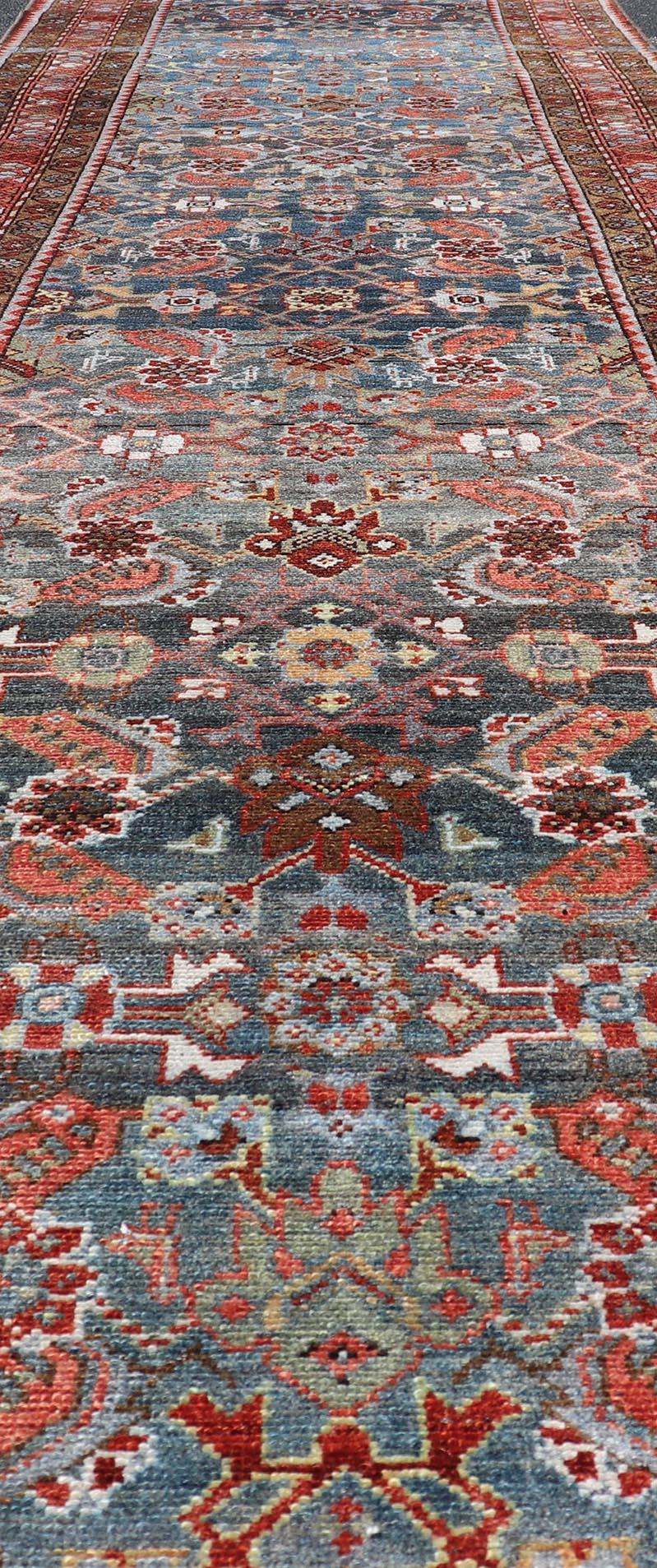 N.W. Persian Antique Runner with Geometric Florals Set on a Blue Field For Sale 1