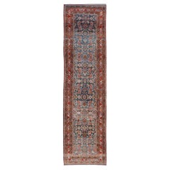 N.W. Persian Antique Runner with Geometric Florals Set on a Blue Field