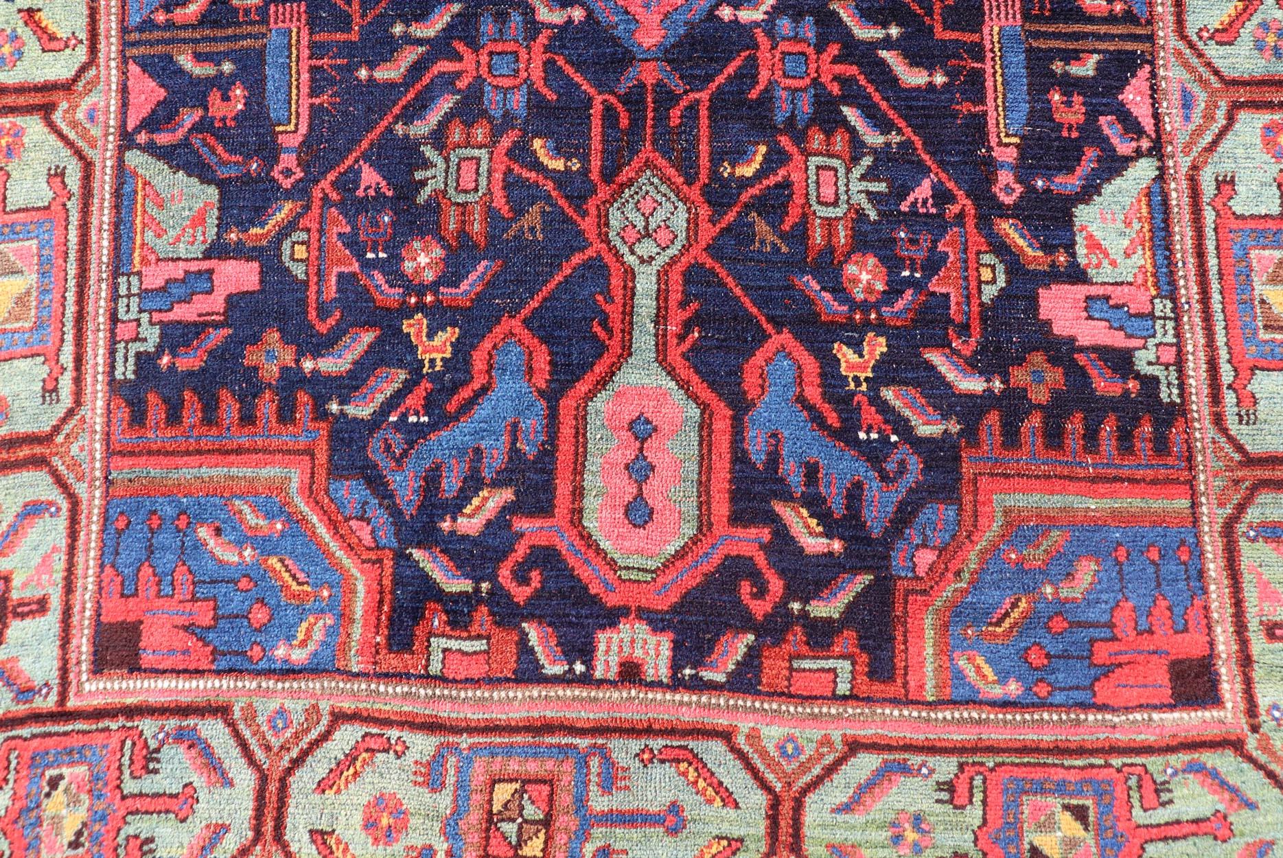 N.W. Persian Rug with Geometric Florals in Red, Ivory, Cream, Blue and Green. Keivan Woven Arts / EMB-8523-178684, country of origin / type: Iran / N.W. Persian, circa 1900.
This early 20th century antique Northwest Persian rug features field
