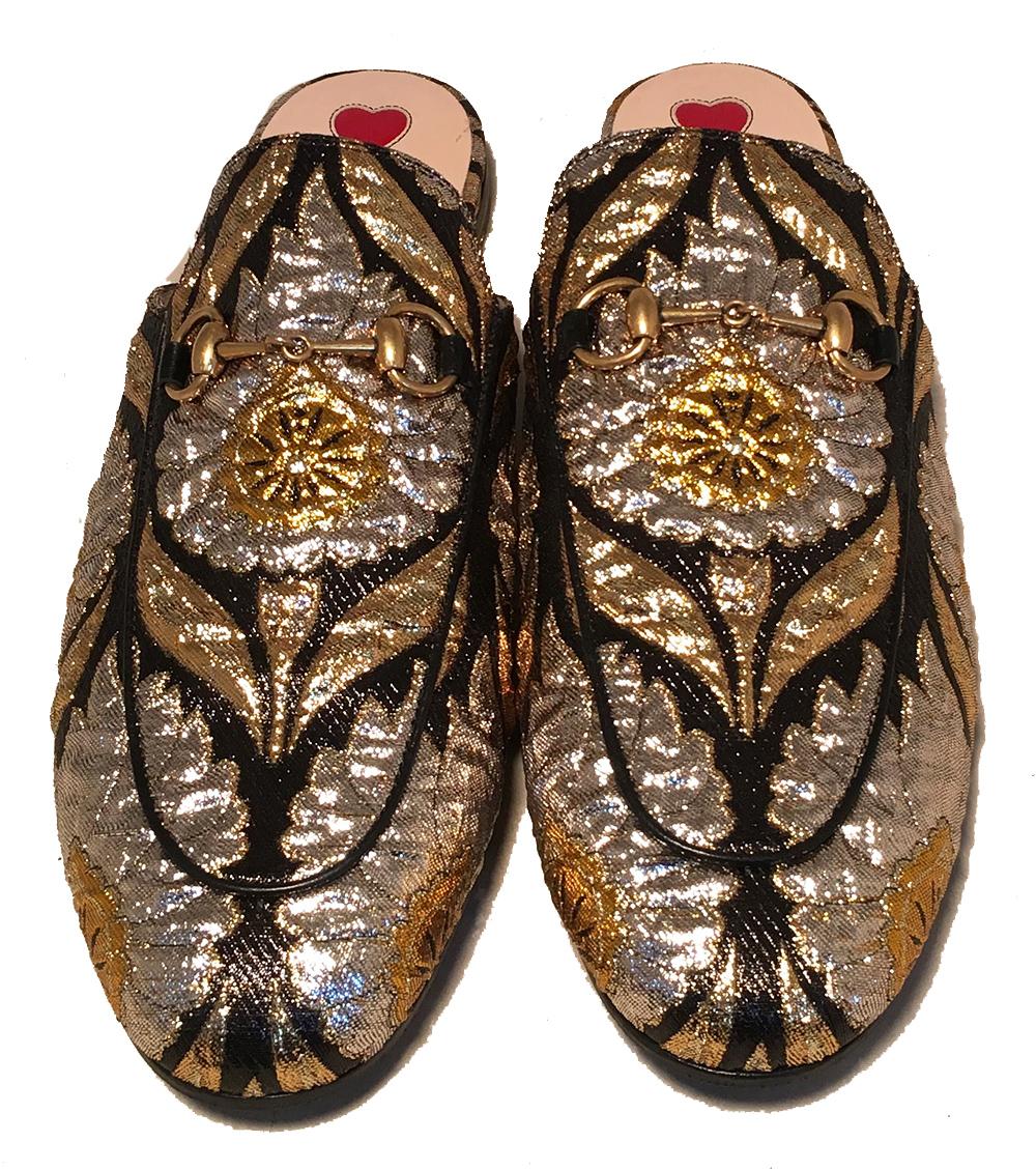 NWOT Gucci Metallic Princetown Lurex Floral Brocade Mule Slides Women's Size 7.5 in excellent unworn condition. Metallic gold, silver and black brocade upper with golden yellow floral design and signature gold tone D ring horsebit hardware. Natural