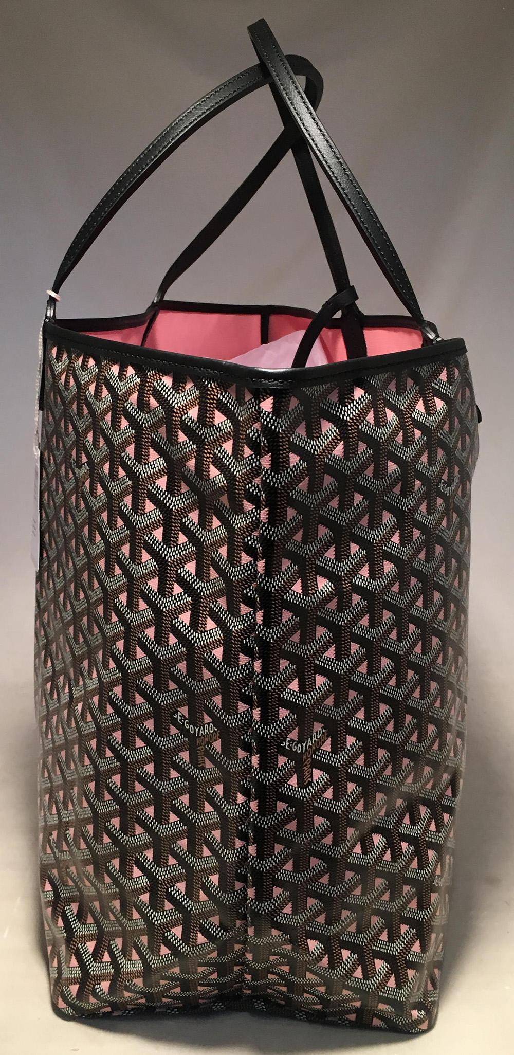 NWOT Limited Edition Goyard Claire Voie Rose Pink Special Color GM St Louis Tote in new condition. Limited edition rose pink and black hand painted canvas exterior with black leather trim. Pink canvas interior. Matching snap pouch attached. Silver