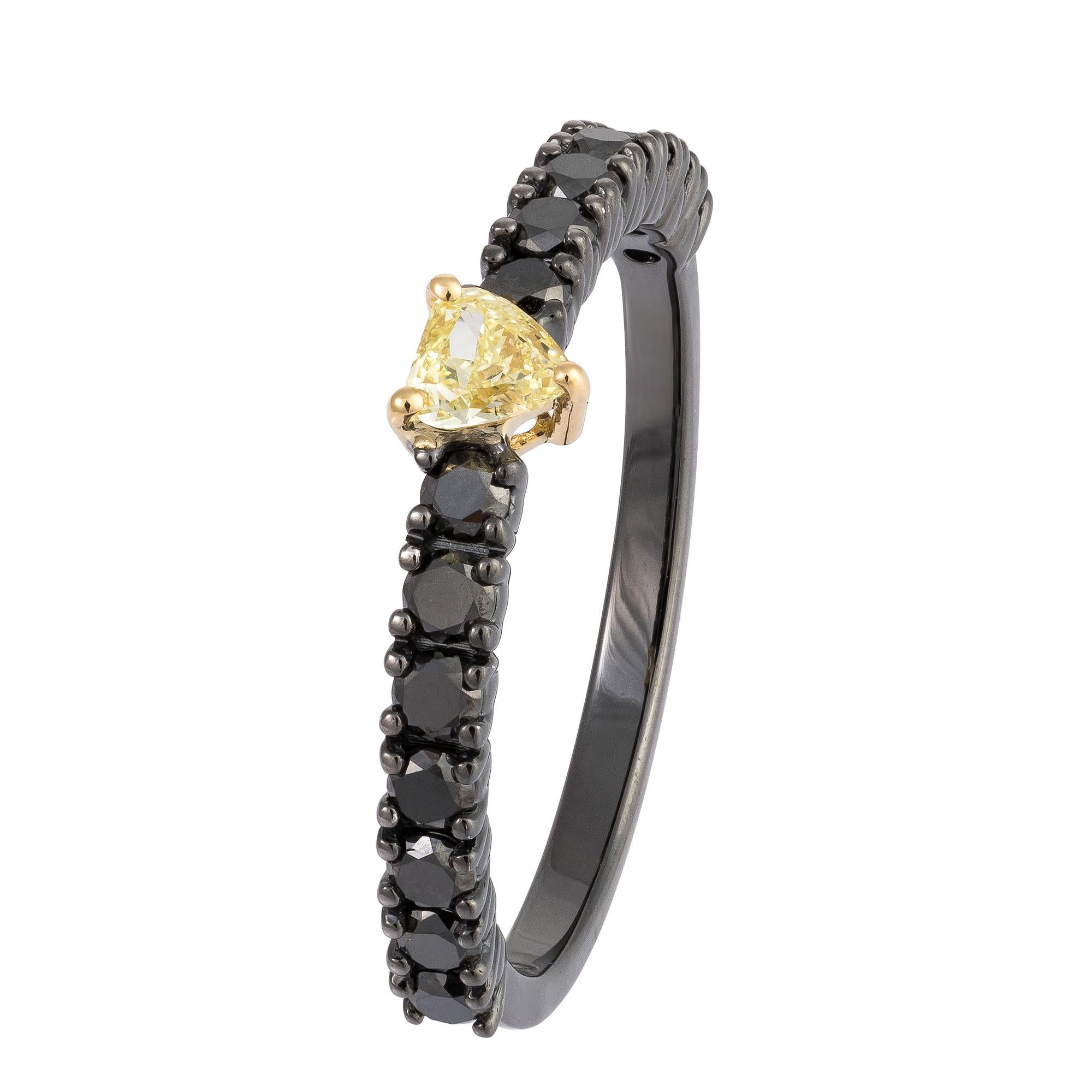The Following Item we are offering is a Rare 18KT Gold Rare Fancy Yellow Diamond Black Diamond Ring. Beautifully comprised of Finely Set Gorgeous Yellow Diamond Heart Shaped Diamond and adorned with Shimmering Black Diamonds!! T.C.W. Approx .75CTS. 