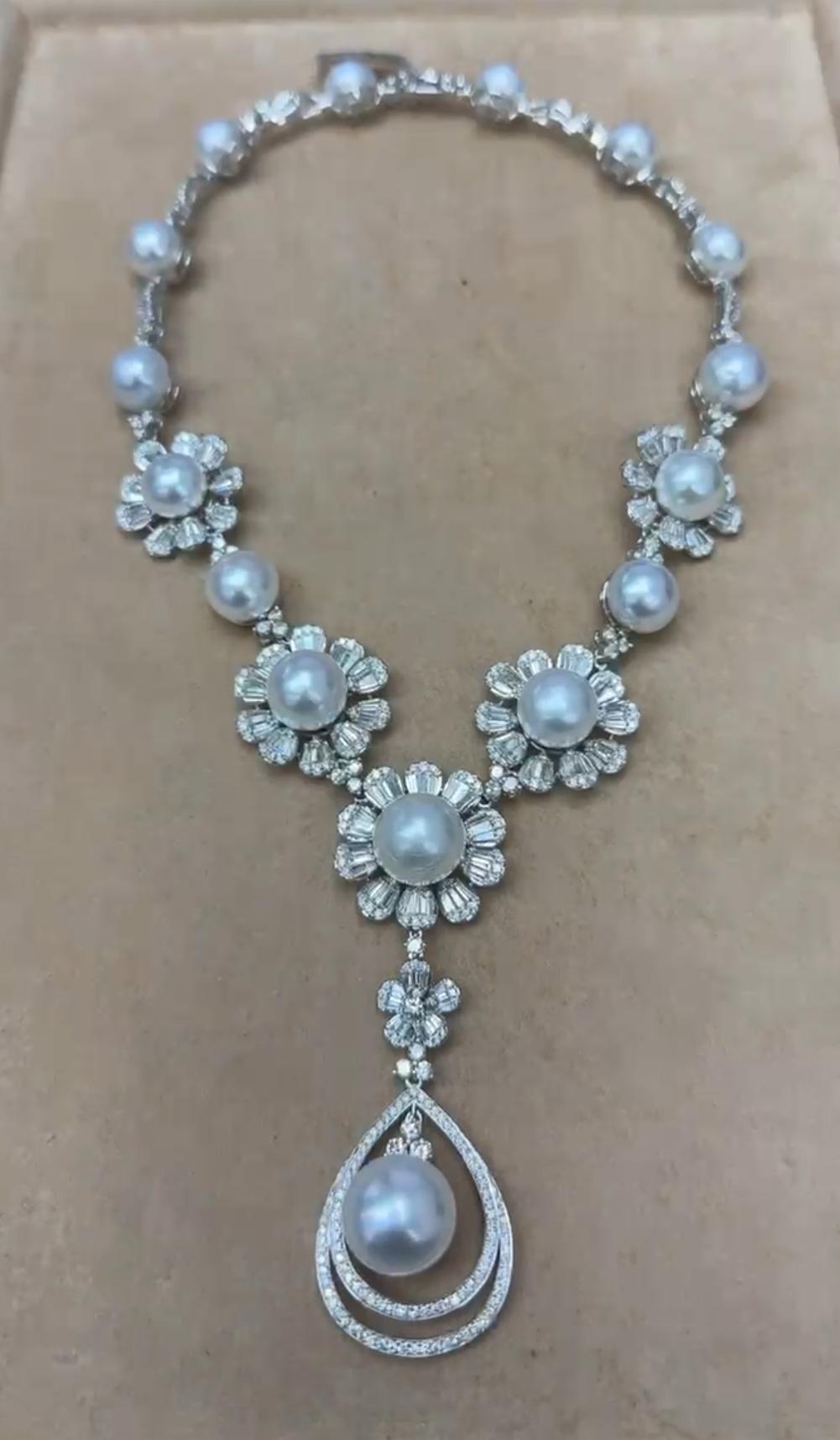 The Following Item we are offering is this Extremely Rare Beautiful 18KT Gold Fine Rare Large White South Sea Pearl Fancy Diamond Flowers Floral Necklace. This Magnificent Necklace is comprised of Rare Fine Large AA-AAA 13-14MM South Sea Pearls with