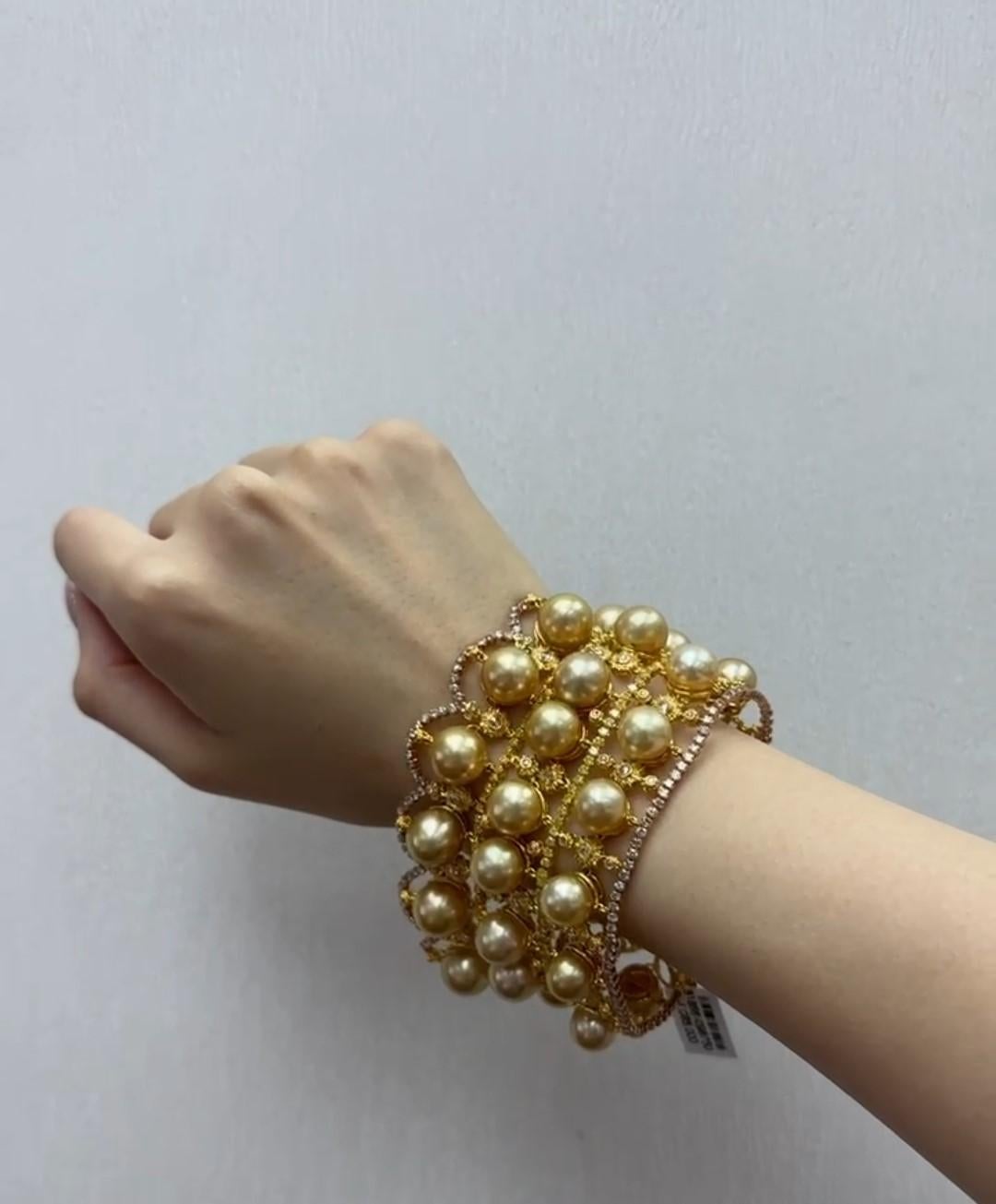 The Following Item we are offering is this Beautiful Rare Important 18KT Gold Fancy Large Golden Pearl and Fancy Yellow Diamond Bracelet. Bracelet is comprised of 34 Magnificent 9-11MM High Luster Large AA-AAA GOLDEN PRISTINE SOUTH SEA PEARLS that