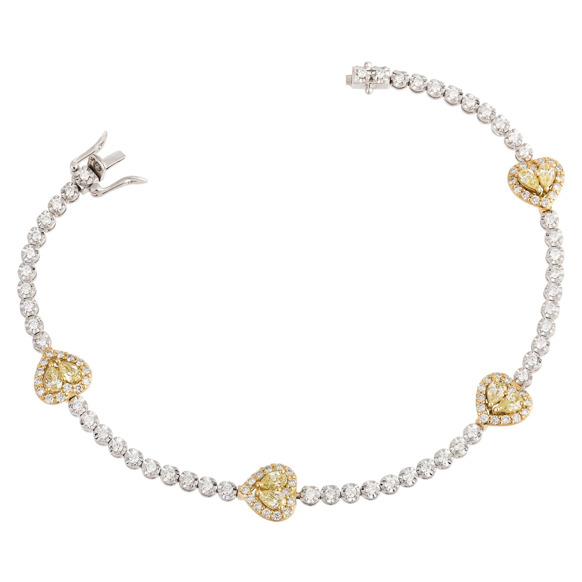 The Following Item we are offering is this Rare Important Radiant 18KT Gold Gorgeous Glittering and Sparkling Magnificent Fancy Yellow Diamond and Diamond Heart Tennis Bracelet. Bracelet contains approx 2CT of Beautiful Fancy Yellow Diamonds