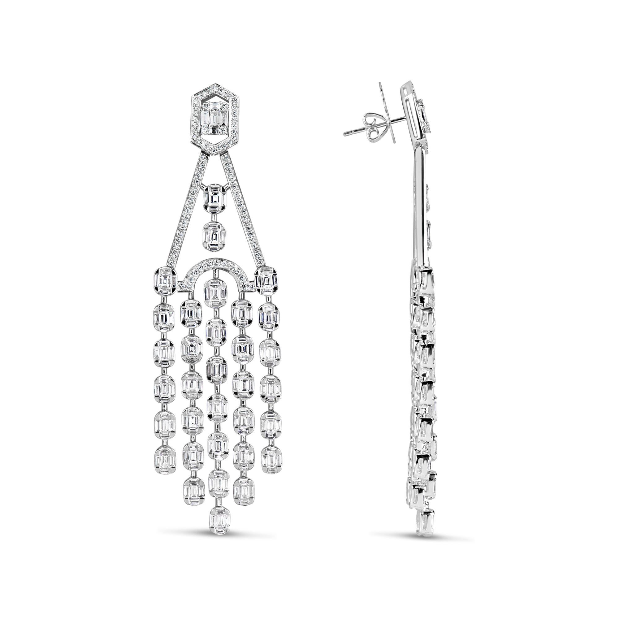 
The Following Items we are offering is a Rare Important Radiant 18KT Gold Glamorous and Elaborate Rare Magnificent Glittering White Diamond Chandelier Earrings. Earrings feature Rare Sparkling White Diamonds set in 18KT Gold!! T.C.W. Approx
