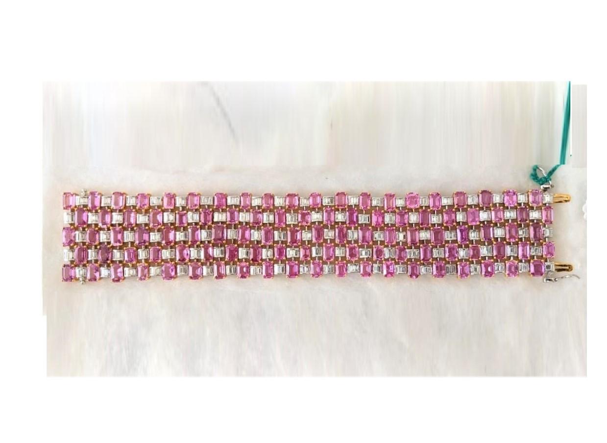 The Following Item we are offering is this Rare Important Radiant 18KT Gold Gorgeous Glittering and Sparkling Magnificent Fancy Emerald Cut Pink Sapphire and Diamond Bracelet Bracelet contains approx 70CTS of Beautiful Fancy Emerald Cut Pink