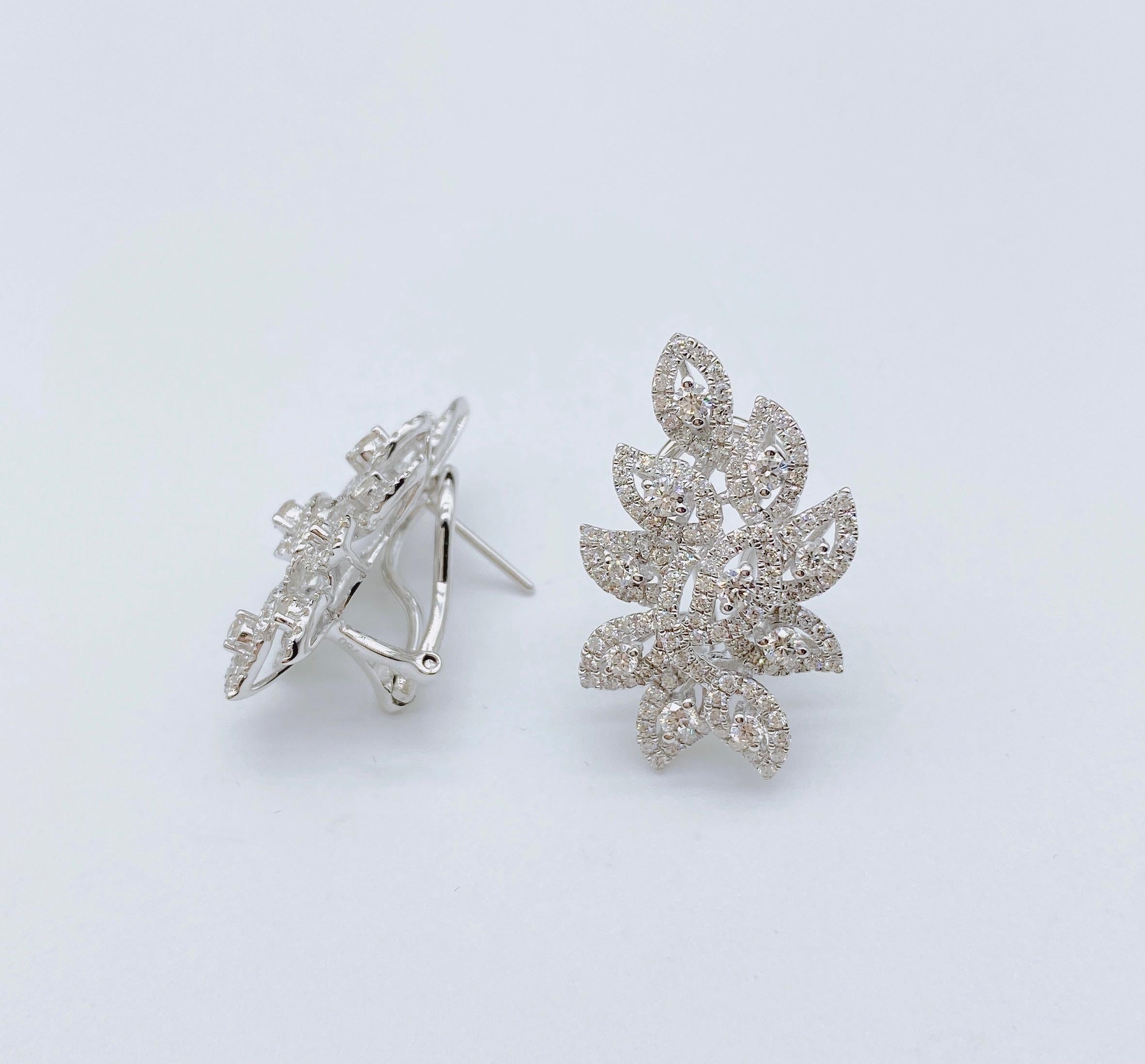 The Following Items we are offering is a Rare Important Radiant 18KT Yellow Gold and 18KT Gold Gorgeous Glittering Leaf Diamond Dangle Earrings. Earrings Feature Gorgeous Rare Fancy Diamonds Framed with Spectacular Glittering Round Diamonds in the
