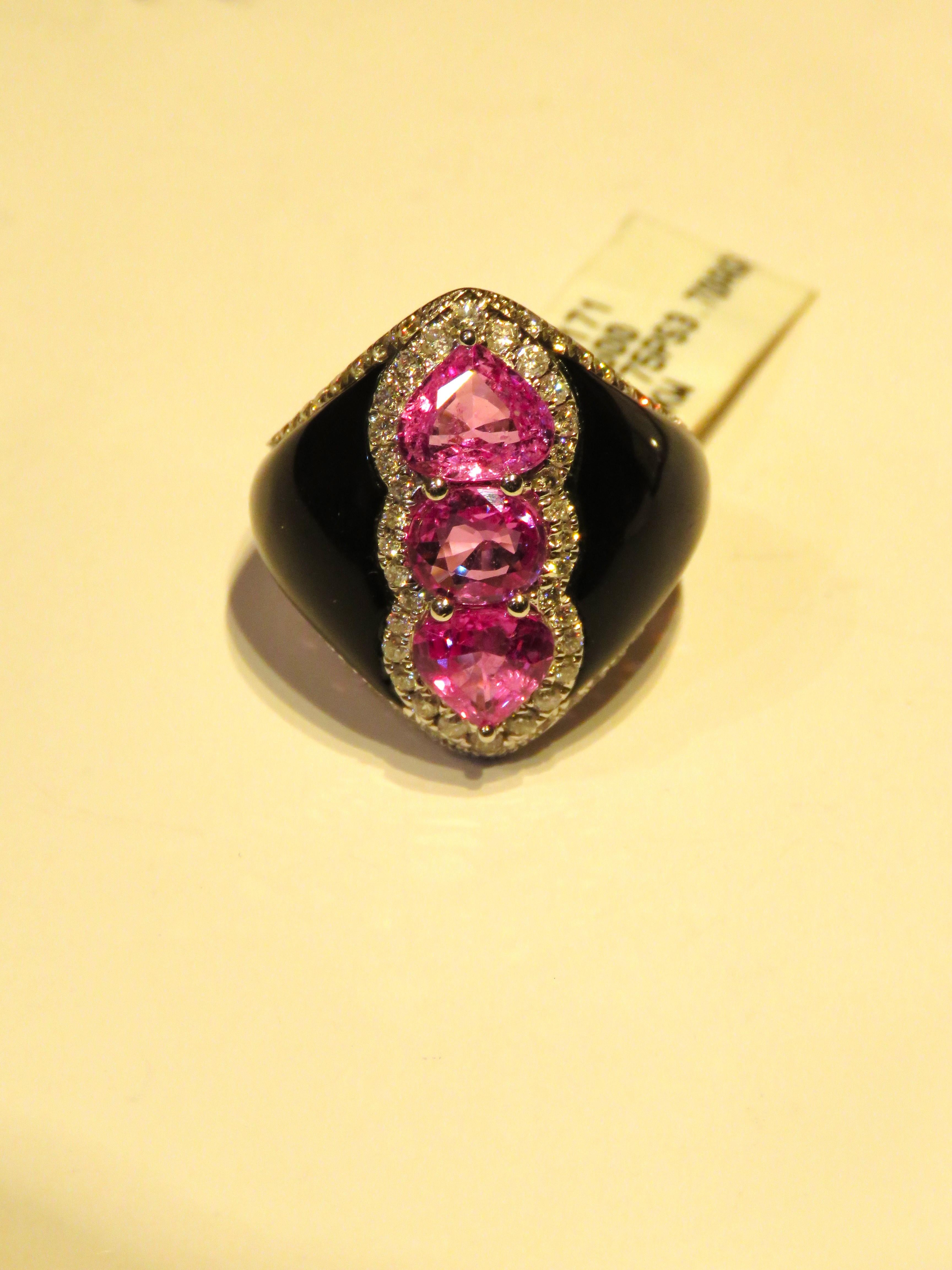 The Following Item we are offering is this Rare Important Radiant 18KT Gold Gorgeous Glittering and Sparkling Magnificent Fancy Heart Cut Pink Sapphire and Diamond Black Agate Ring. Ring contains approx 12.50CTS of Beautiful Black Agate, Fancy Heart