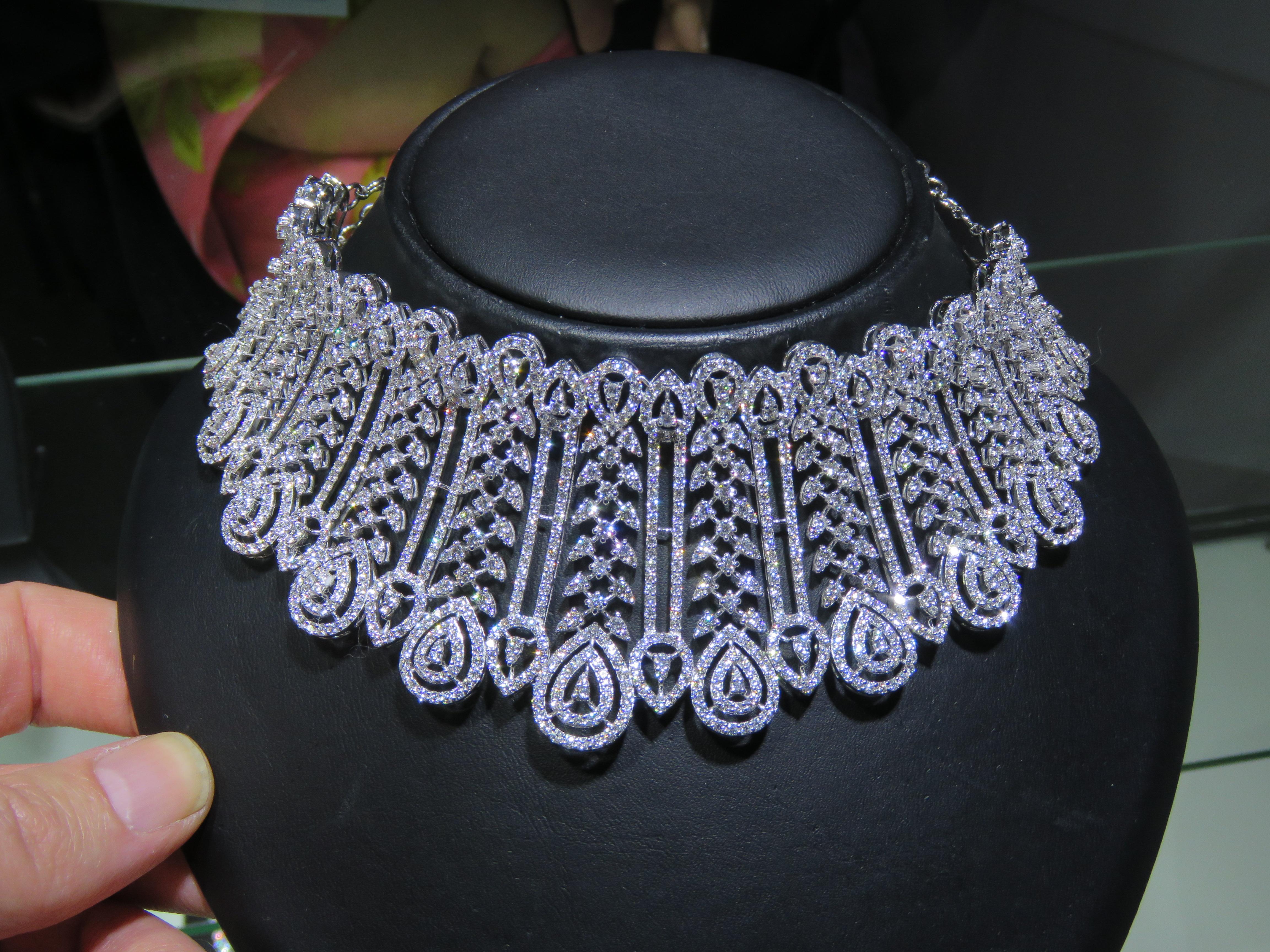 The Following Item we are offering is a Rare 18KT Gold Rare Fancy Diamond Choker Floral Necklace. Beautifully comprised of Finely Set Gorgeous Round Fancy Diamonds!! T.C.W. Approx 24CTS!!  This Gorgeous Necklace is a Rare Sample Piece  from a Top
