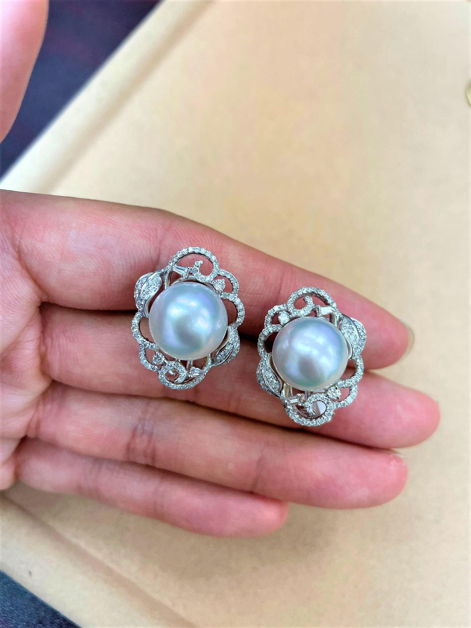 The Following Items we are offering are these Extremely Rare Beautiful 18KT White Gold Fine Large South Sea White Pearl Earrings comprised of Fine Glittering Fancy Tapered and Round White Diamonds in the form of Floral Petals!! These Extremely Rare