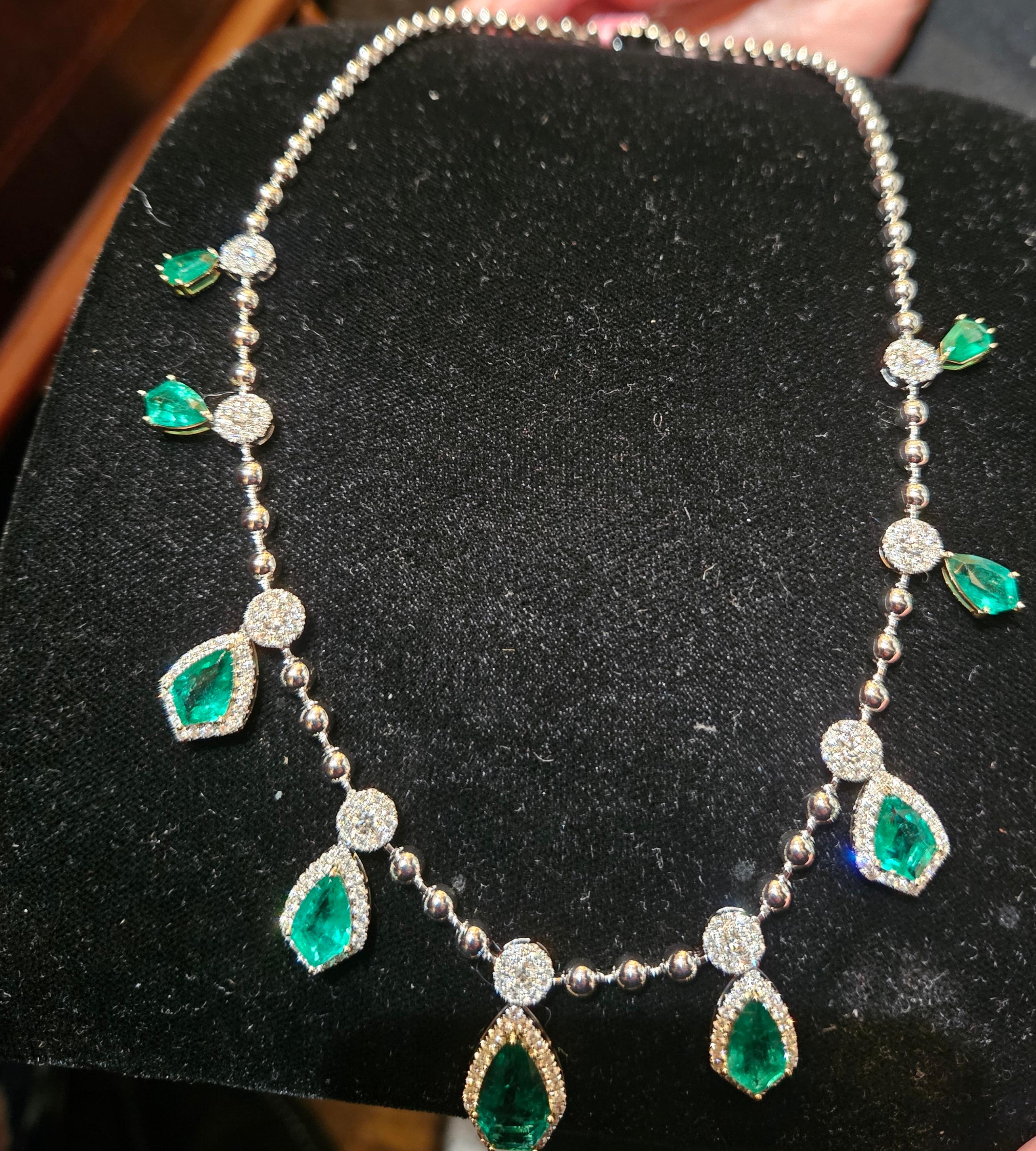 A Rare 18KT White Gold Emerald Diamond Necklace. Necklace is comprised of Finely Set Glittering Gorgeous Diamond Shaped Emeralds adorned with Sparkling Diamonds!!! The Emeralds and Diamonds are of Exquisite and Fine Quality. T.C.W. approx