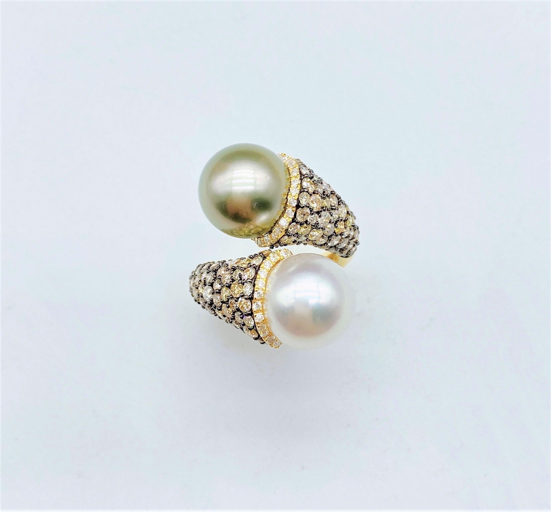 The Following Item we are offering is this Extremely Rare Beautiful 18KT Gold Fine Rare Large South Sea Pearl and Gray Tahitian Pearl Crossover Fancy Yellow Cognac Diamond Ring. This Magnificent Ring is comprised of Rare Fine Large South Sea Pearls