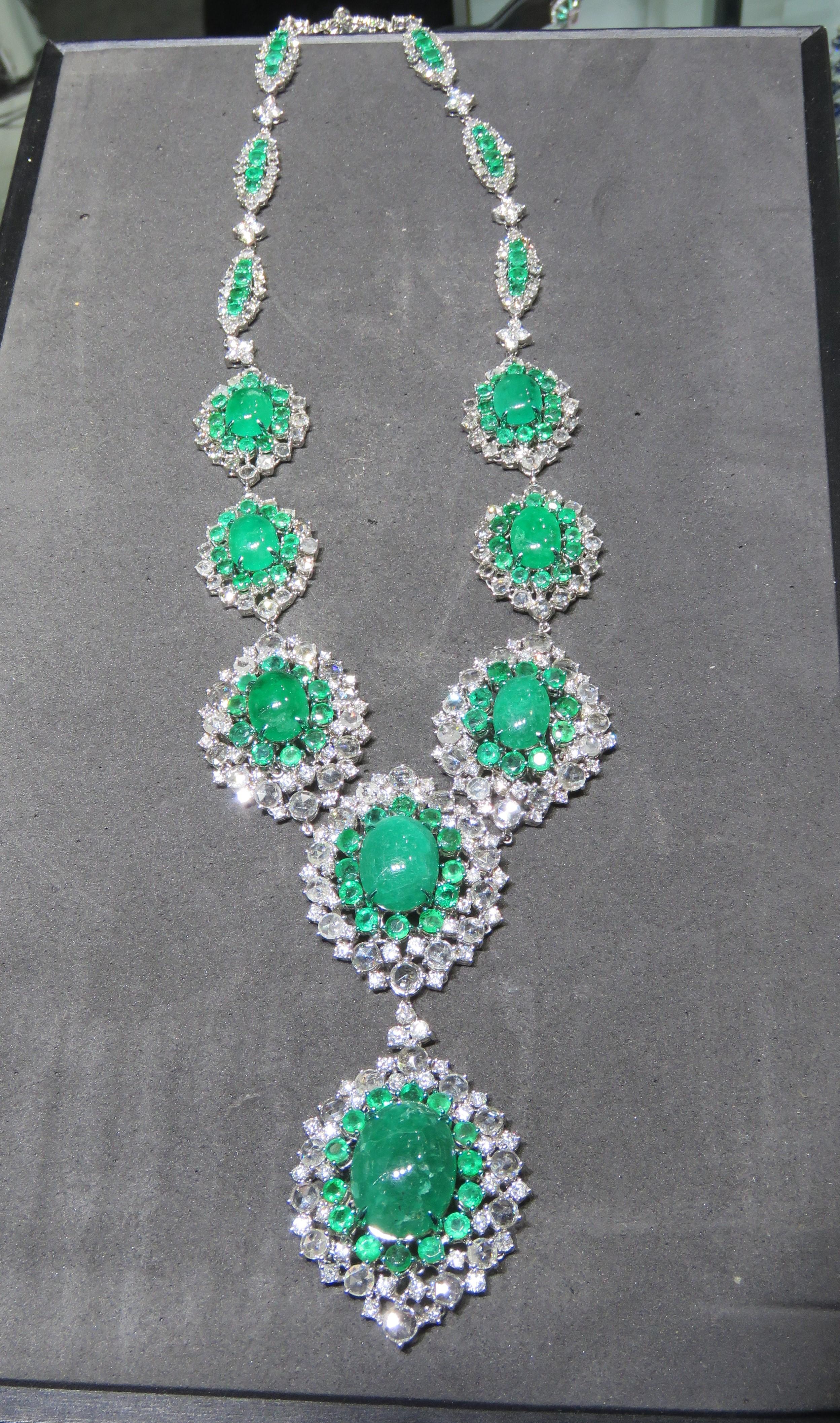 A Rare 18KT White Gold Emerald Diamond Necklace. Necklace is comprised of Finely Set Glittering Gorgeous Cabochon Emerald Necklace adorned with Sparkling Rose Cut and Round Diamonds and Round Emeralds!! T.C.W. approx 70CTS!!! This Gorgeous Necklace