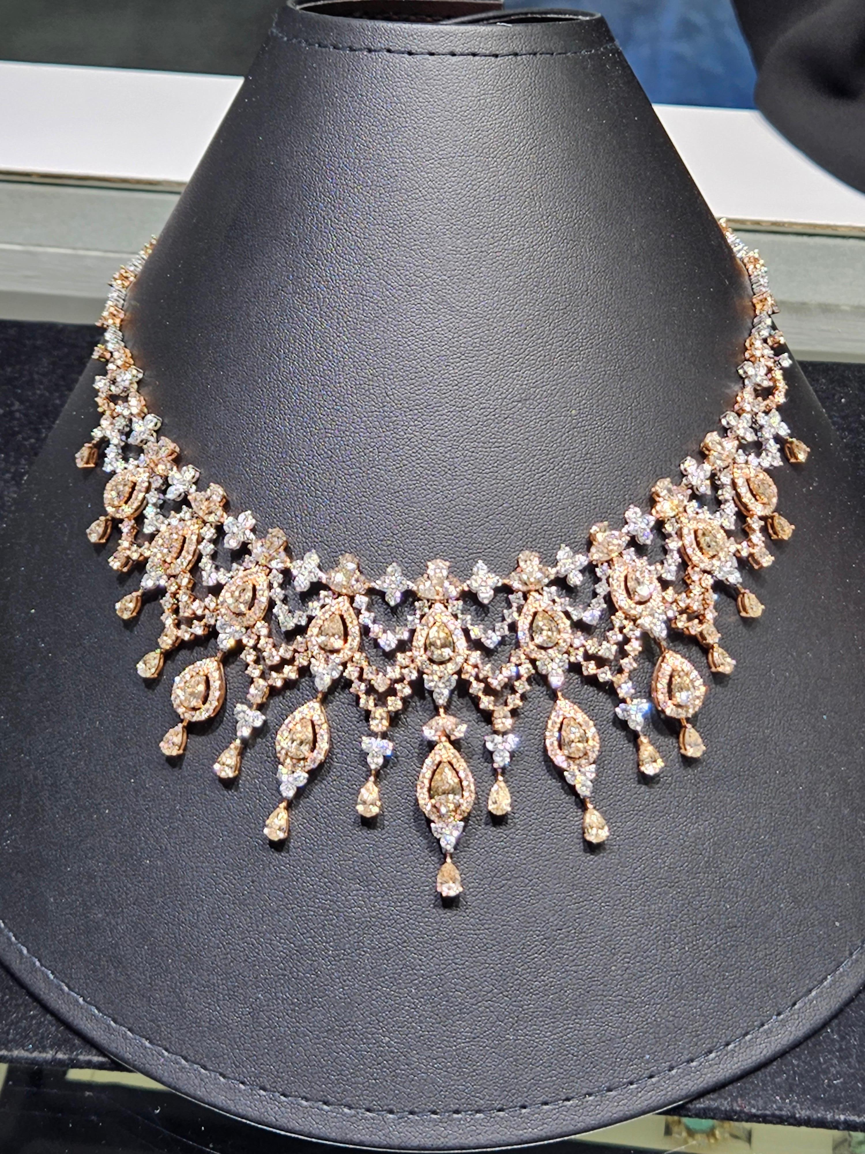 The Following Item we are offering is this Extremely Rare Beautiful 18KT Gold Fine Rare Large Fancy Yellow and Champagne Diamonds and White Diamonds Elaborate Masterpiece of a Necklace. This Magnificent Necklace is comprised of Rare Fine Large