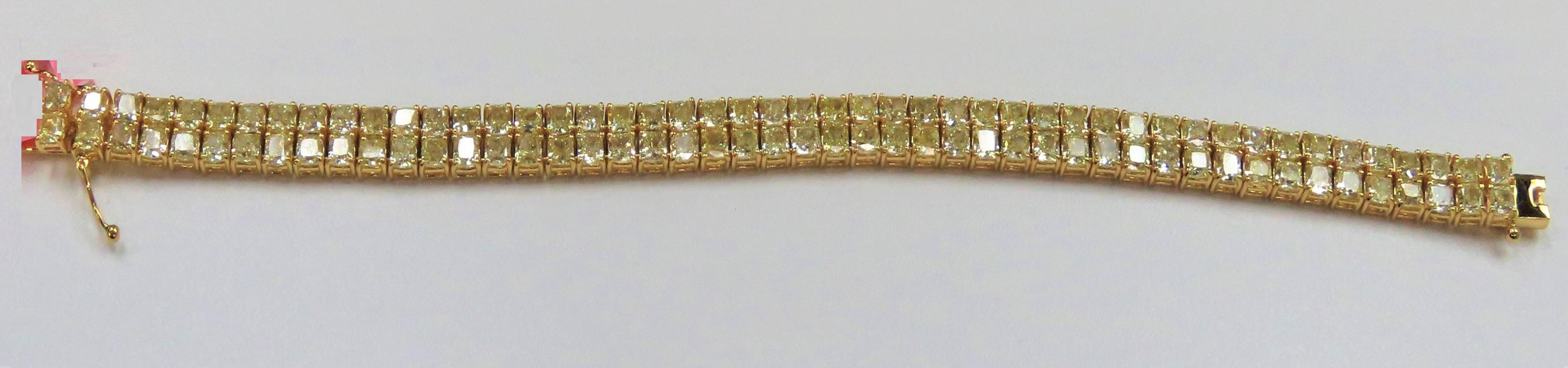 The Following Item we are offering is a Rare Important Radiant 18KT Gold Fancy Yellow Diamond Bracelet! This Magnificent Fancy Yellow Diamond Bracelet has approx 24CTS of Fine Fancy Yellow Diamonds!! This Gorgeous Bracelet is a Rare Masterpiece from