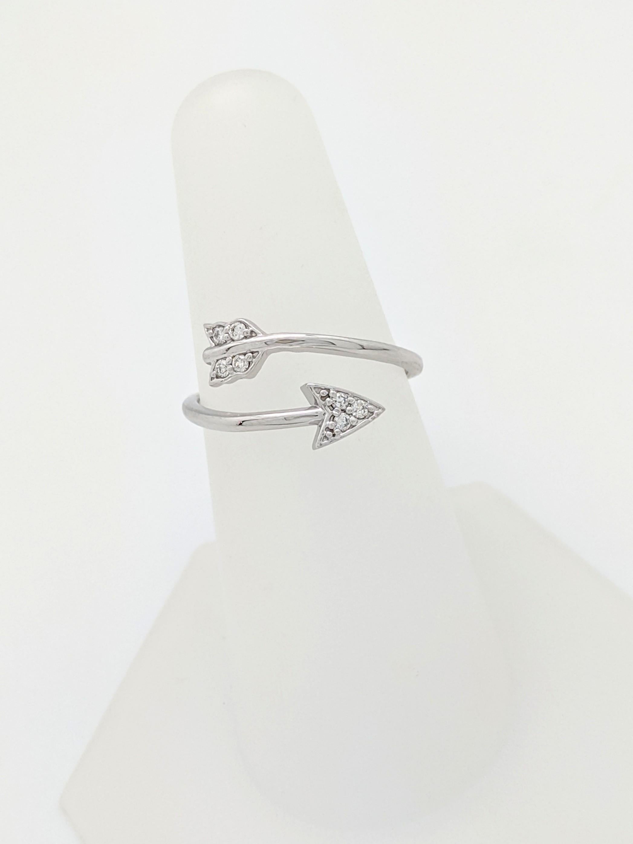 NWT 14K White Gold Open Diamond Arrow Ring

You are viewing a Beautiful Open Diamond Arrow Ring. This ring is crafted from 14k white gold and weighs 2 grams. It features (7) natural round brilliant cut diamonds for an estimated 0.10tcw. We estimate