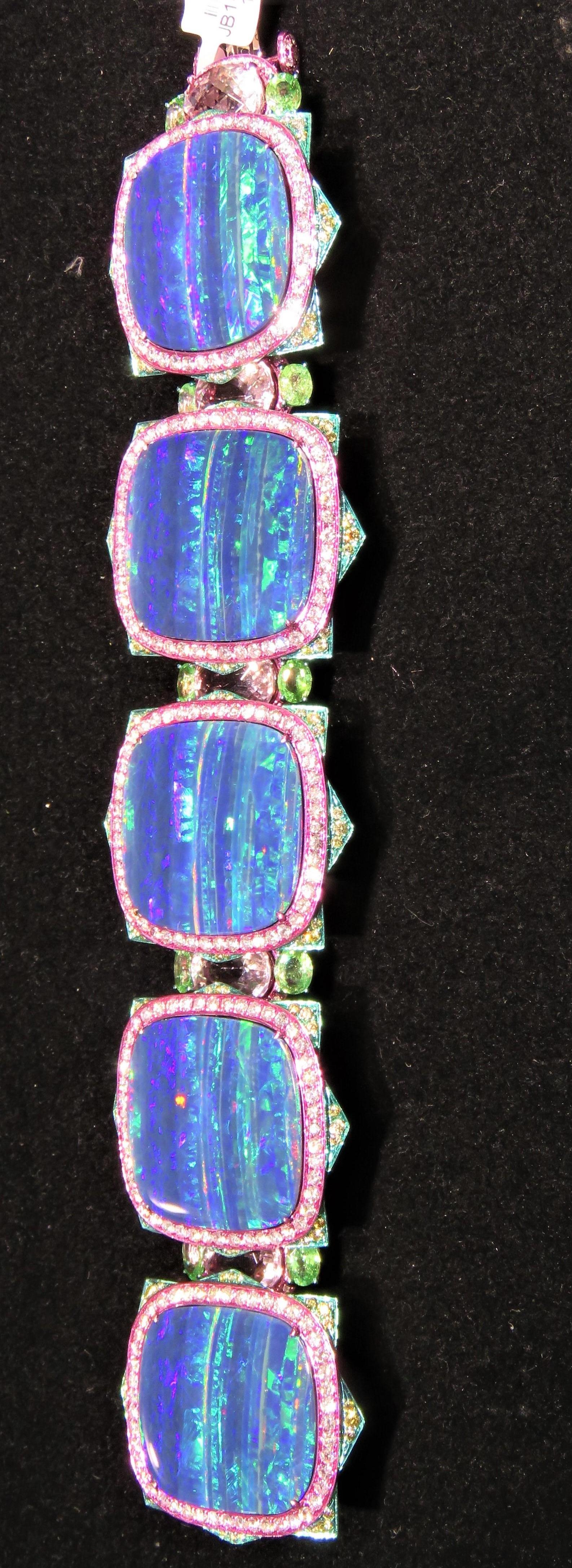 The Following Items we are offering is a Rare Important Radiant 18KT Gold Glistening Magnificent Large Fancy Black Opal Gorgeous Rare Paraiba, Morganite and Diamond Bracelet. Bracelet features Exquisite Fancy Black Opals adorned with Rare Fancy