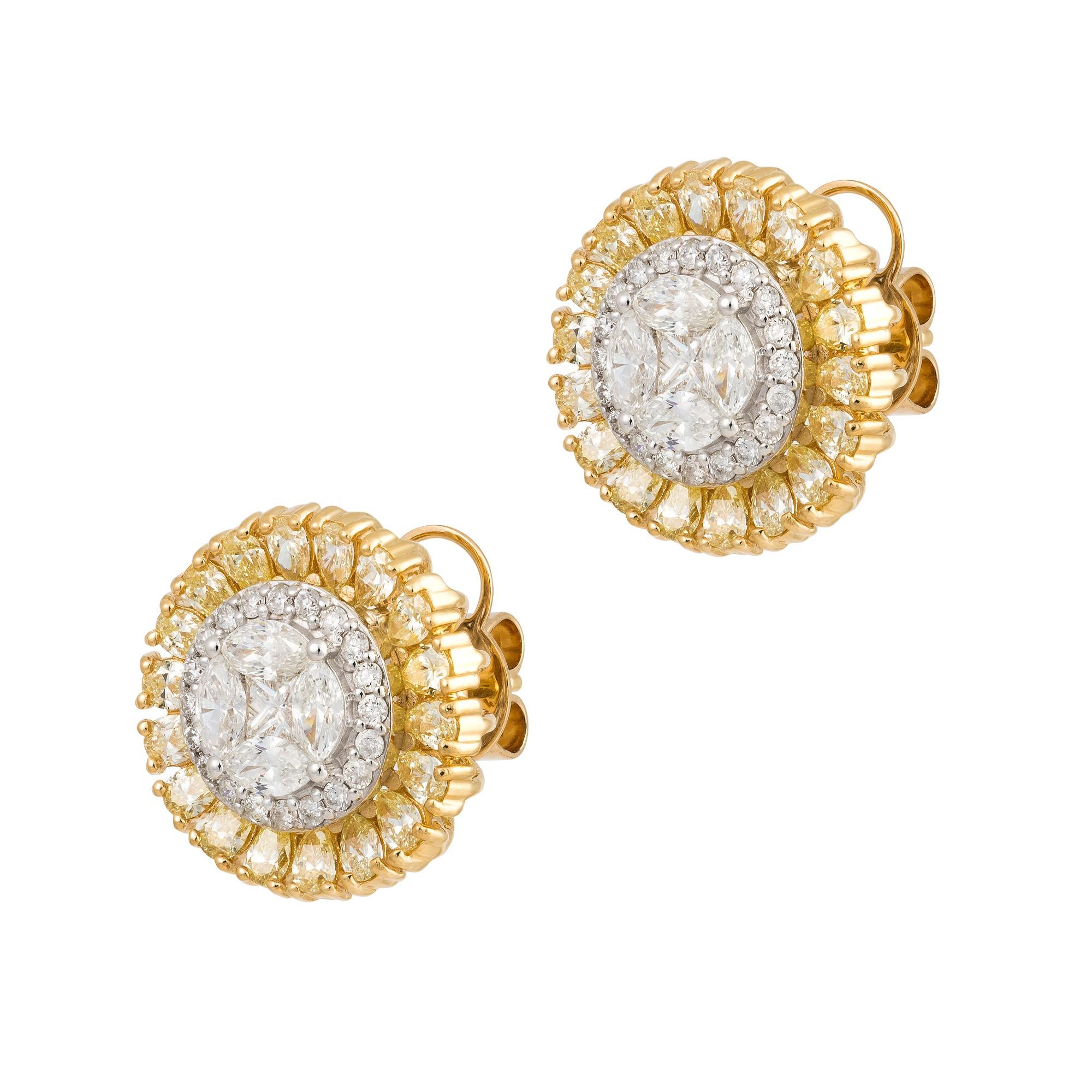 The Following Item we are offering are these Extremely Rare Beautiful 18KT Gold Fine Large Fancy Yellow Diamond White Diamond Stud Earrings. Each Earring features Rare Gorgeous Glittering Fancy White Diamonds surrounded by Halo of Fancy Yellow