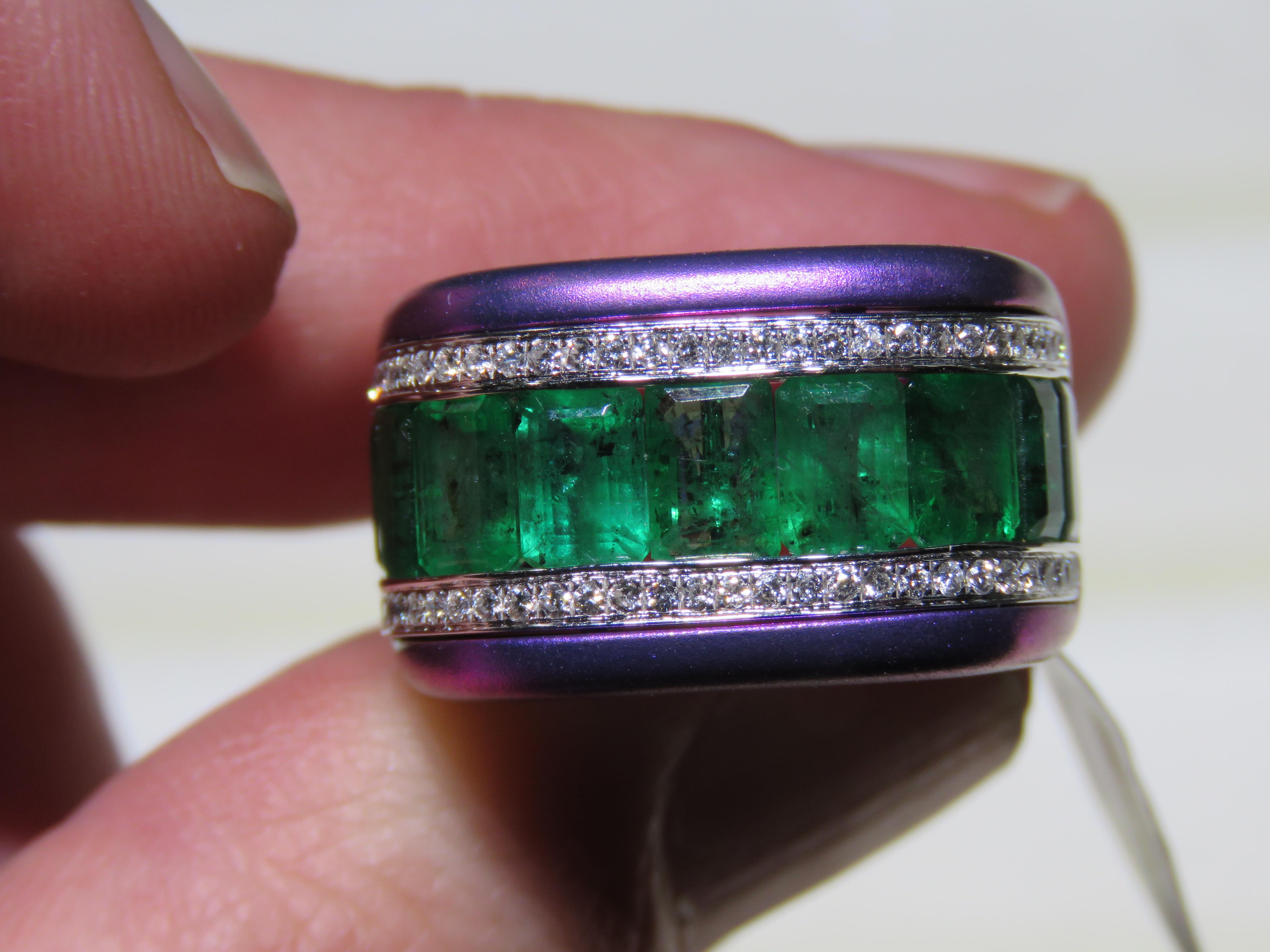 The Following Item we are offering is this Rare Important Radiant 18KT Gold and Titanium Gorgeous Glittering and Sparkling Magnificent Fancy Emerald Cut Green Emerald and Fancy Diamond Ring. Ring Contains approx 9CTS of a Beautiful Fancy Cut