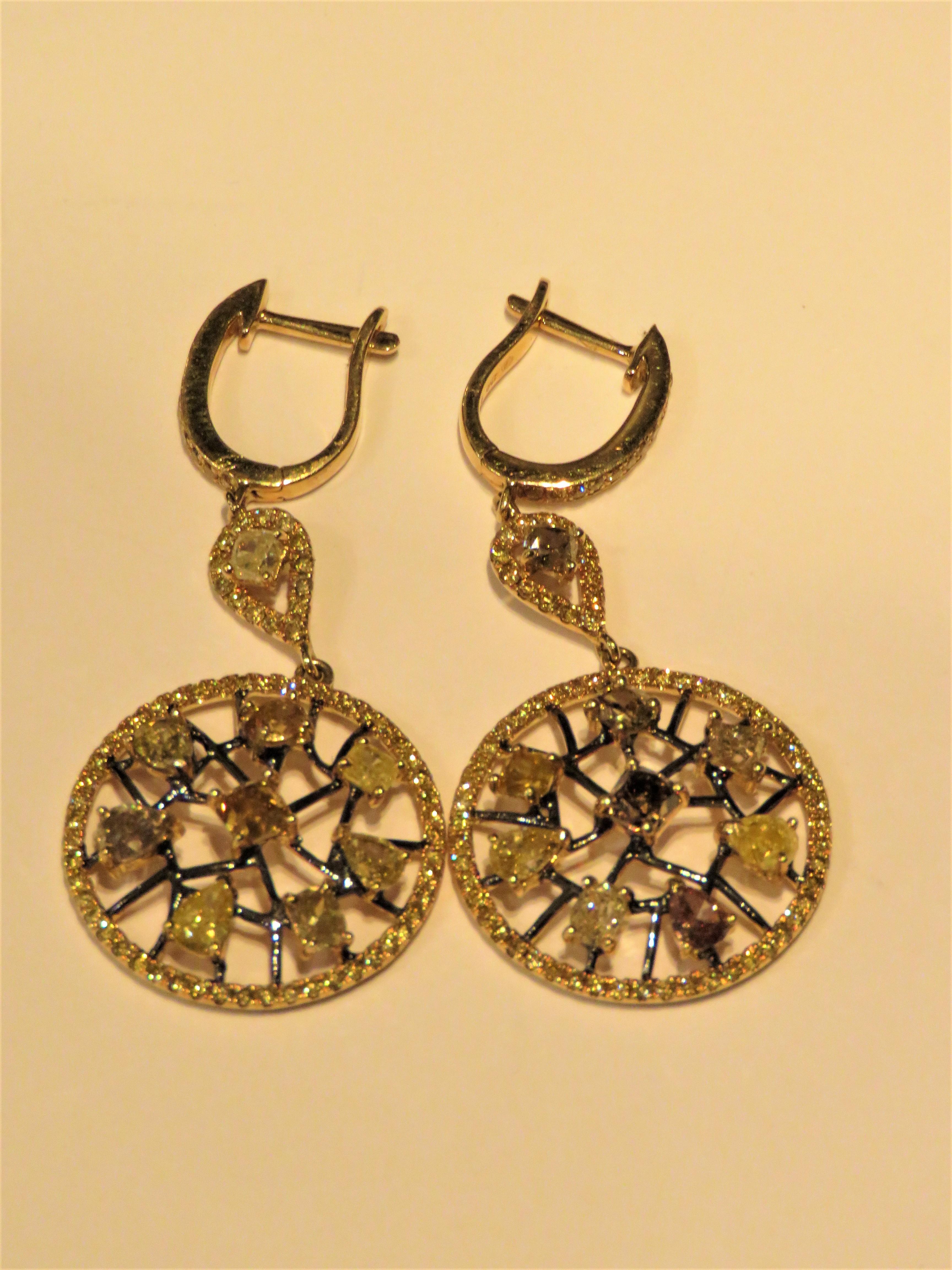 The Following Item we are offering are these Rare Beautiful 18KT Gold Yellow, Cognac, and Champagne Diamond Earrings. Earrings are comprised of approx. 4 Carats of Fine Glittering Fancy Colored Diamonds across a Black Gold Web. The Diamonds are of