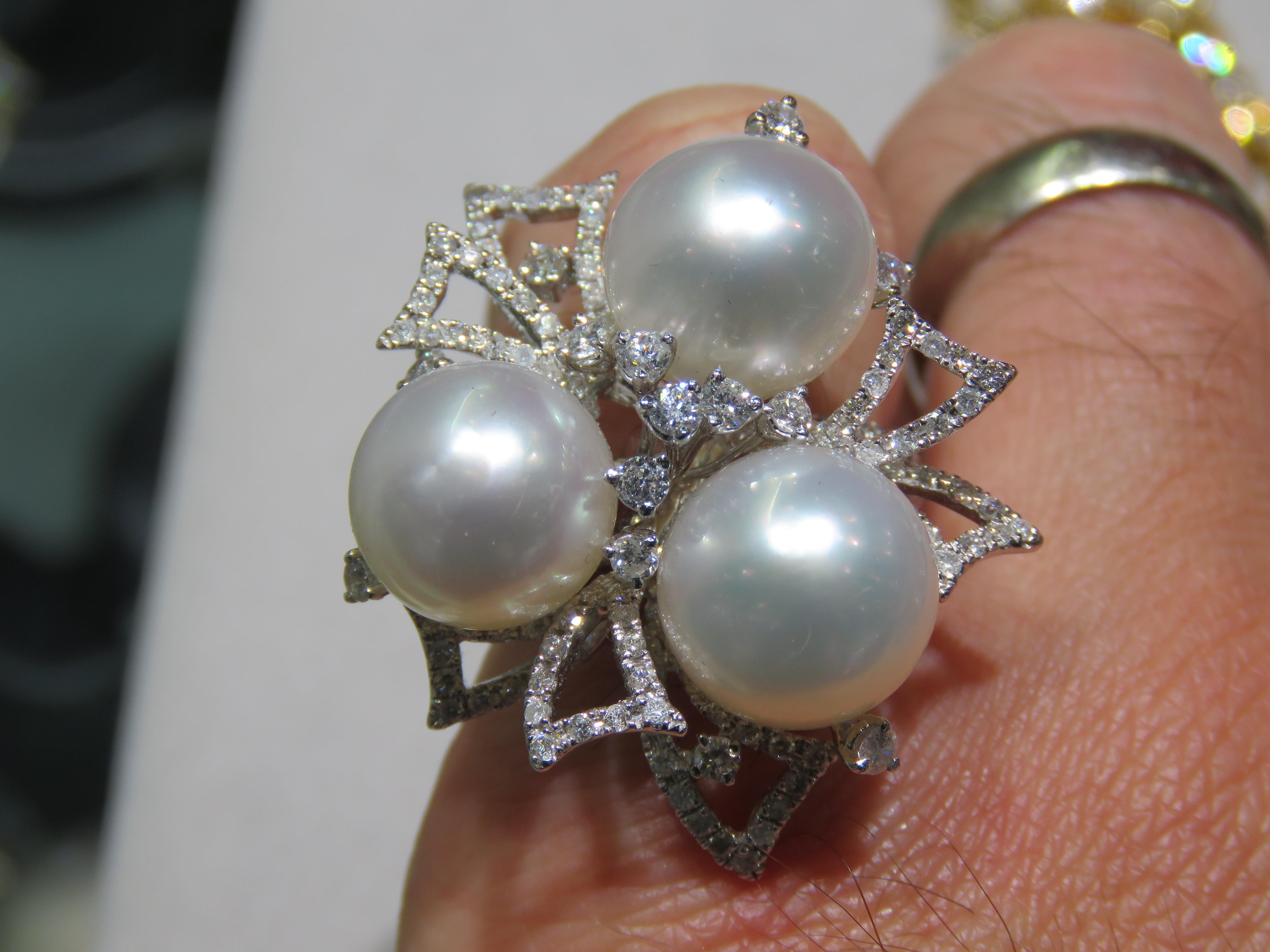 The Following Item we are offering is this Extremely Rare Beautiful 18KT Gold Fine Rare Fancy Large South Sea Pearl Fancy Diamond Ring. This Magnificent Ring is comprised of Rare Fine Large 11-12MM Fancy South Sea Pearls surrounded with Gorgeous