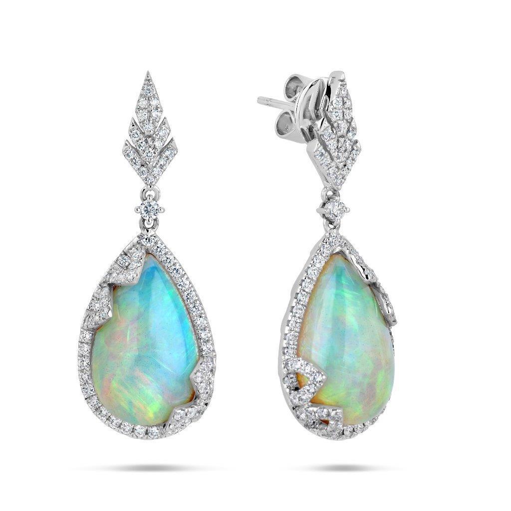 The Following Item we are offering is a Rare Important Radiant 18KT Gold Large Rare Fancy Gorgeous Opal Earrings. Earrings are comprised of LARGE Gorgeous Fancy Opals surrounded and adorned with Beautiful Glittering Diamonds!!! T.C.W. Approx