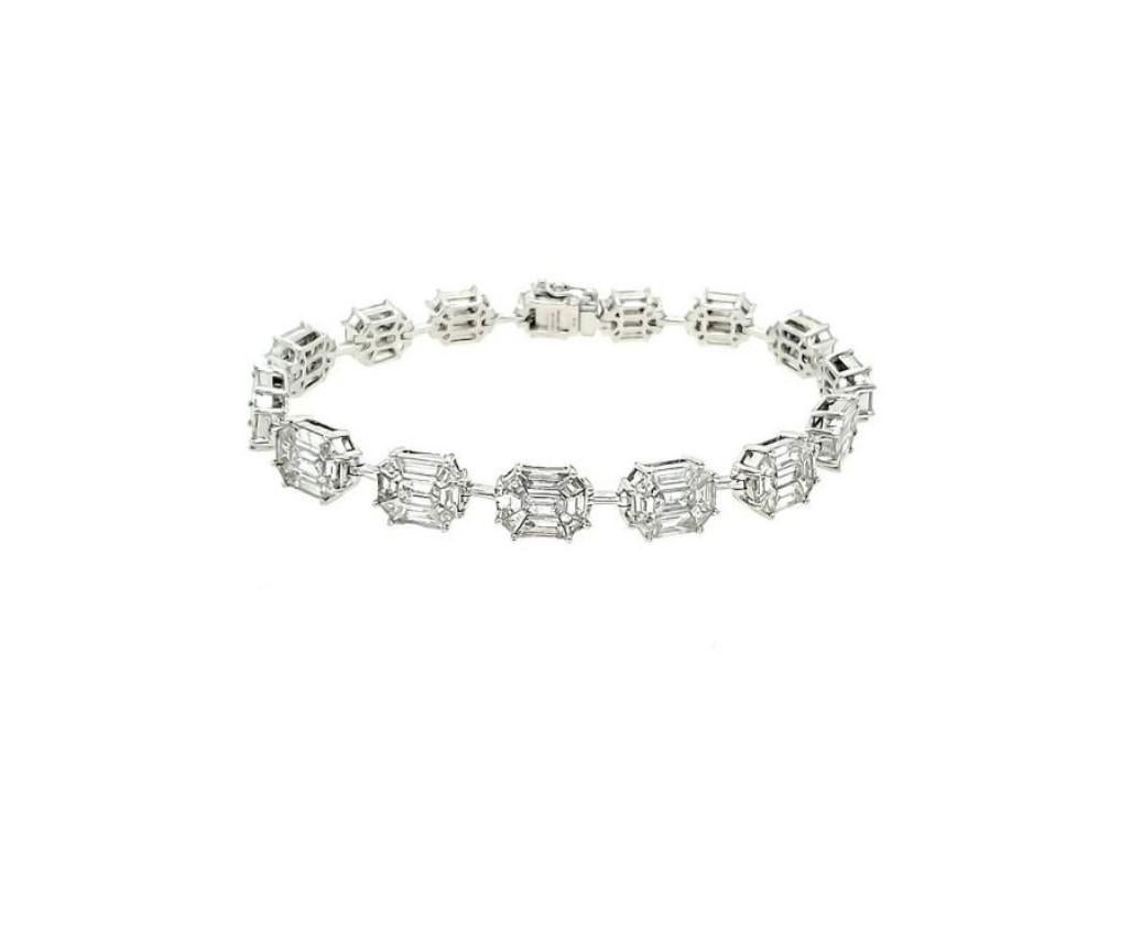 The Following Item we are offering is this Beautiful Rare Important 18KT Gold Sparkling Bracelet Diamond Baguette Tennis Bracelet. This Rare Bracelet features an Array of Magnificent Rare Diamonds. T.C.W. Approx 9.50CTS!!
The Diamonds are of