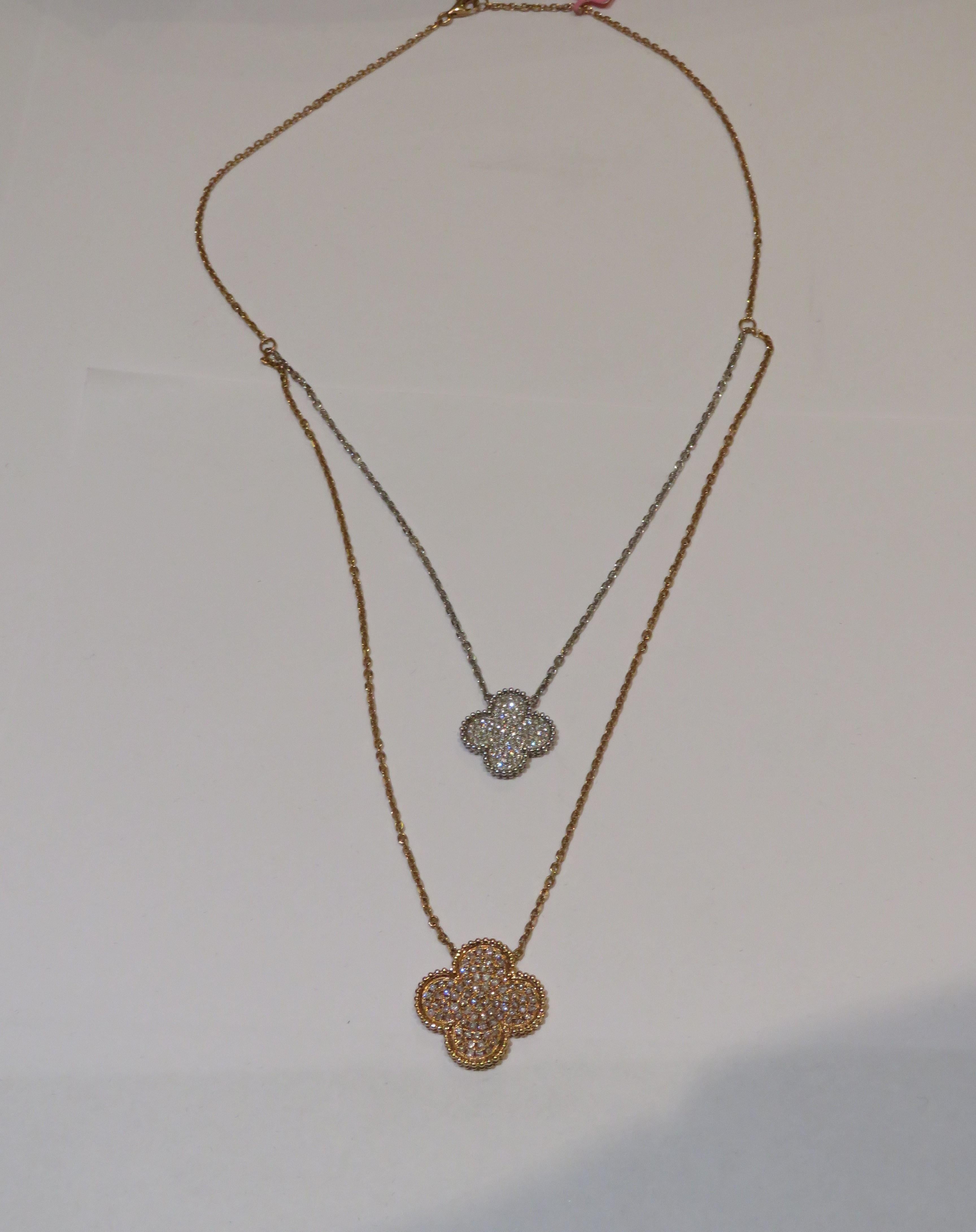 The Following Item we are offering is A Rare 18KT Gold Fancy Large Double Clover Pink Diamond Necklace. Necklace is comprised of Finely Set Glittering Gorgeous Fancy Pink Diamonds 1 Clover and adorned with a smaller White Diamond clover!!! The