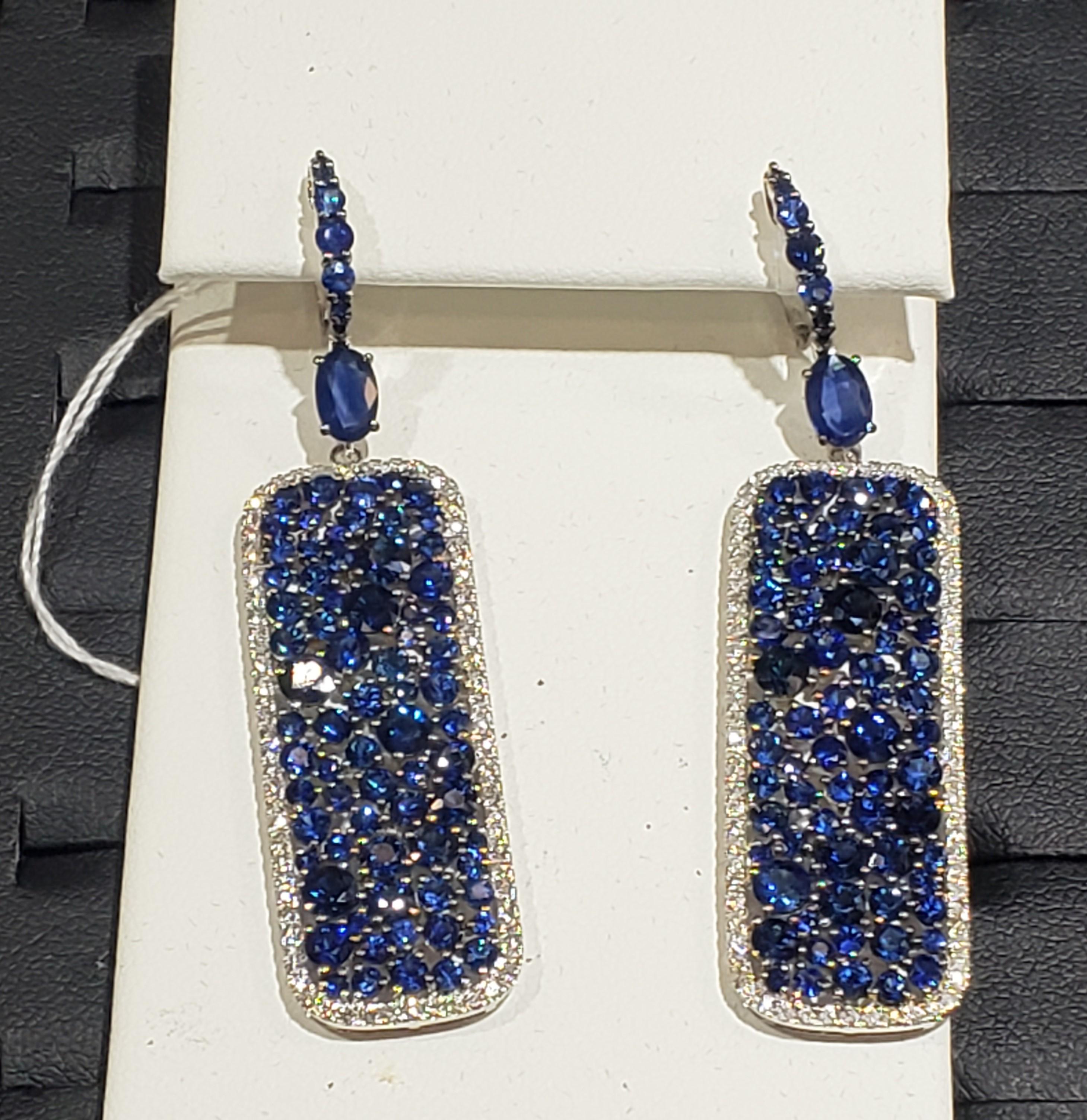 The Following Item we are offering is a Rare Important Radiant 18KT Gold Pair of Rare Gorgeous Large Shimmering Blue Sapphire and Diamond Dangle Earrings. Earrings are comprised of Beautiful Shimmering Assorted Magnificent Blue Sapphires with