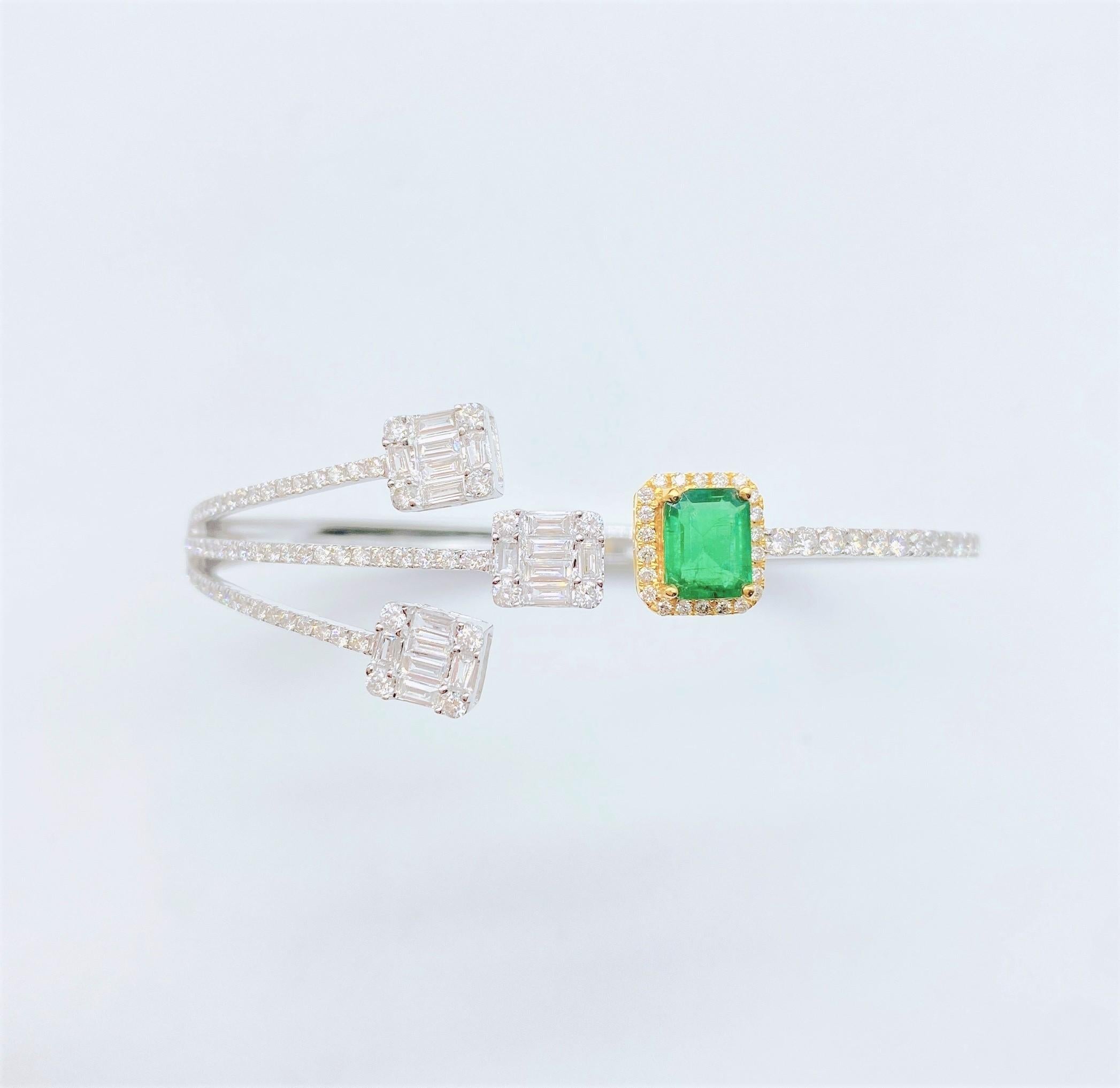 The Following Items we are offering is this Rare Important Radiant 18KT Gold Gorgeous Glittering and Sparkling Magnificent Fancy Emerald and Diamond Bangle Cuff. Bangle features a Beautiful Fancy Cut Emeralds and Fancy Trillion Baguette and Round
