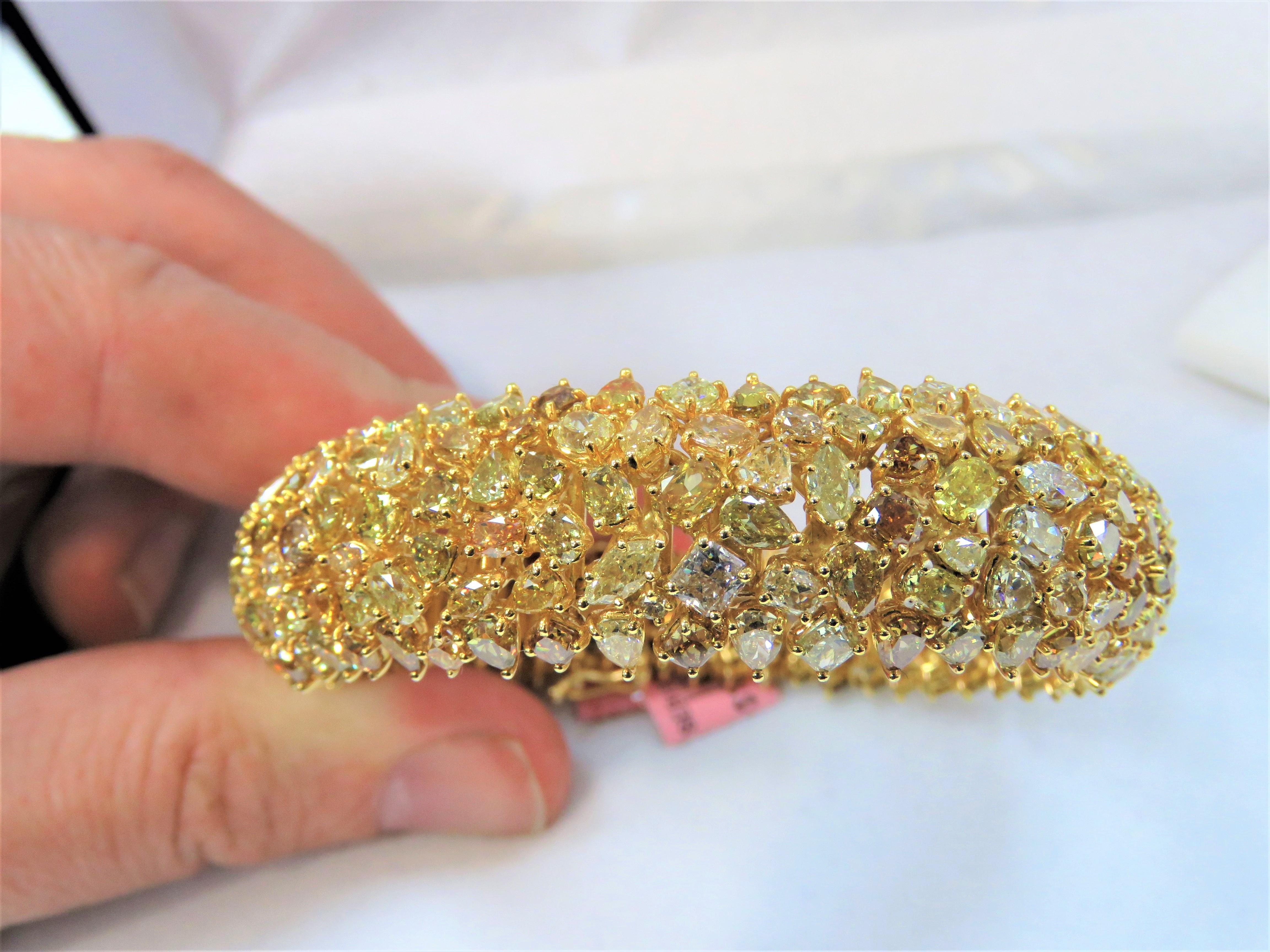 The Following Item we are offering is a Rare Important Radiant 18KT Gold Fancy Yellow Diamond Bracelet! This Magnificent Fancy Yellow Diamond Bracelet Features Pristine Cut Fancy assorted shades of Fancy Yellow Diamonds!! This Gorgeous Bracelet is a