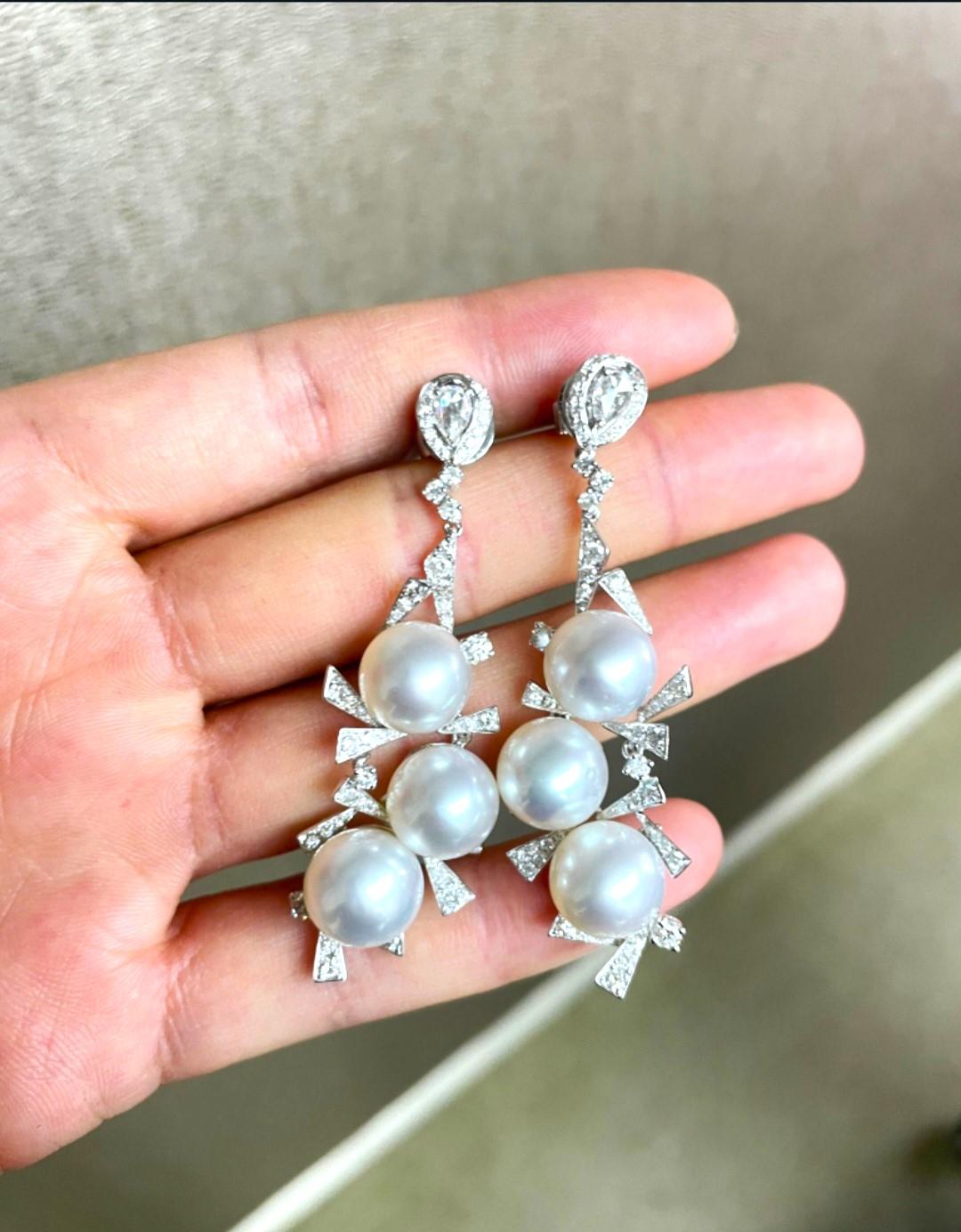 The Following Item we are offering is this Extremely Rare Beautiful 18KT Gold Fine Rare Large South Sea Pearl Fancy Diamond Dangle Drop Earrings. These Magnificent Earrings are comprised of 6 Rare Fine Large AA-AAA South Sea Pearls with Gorgeous