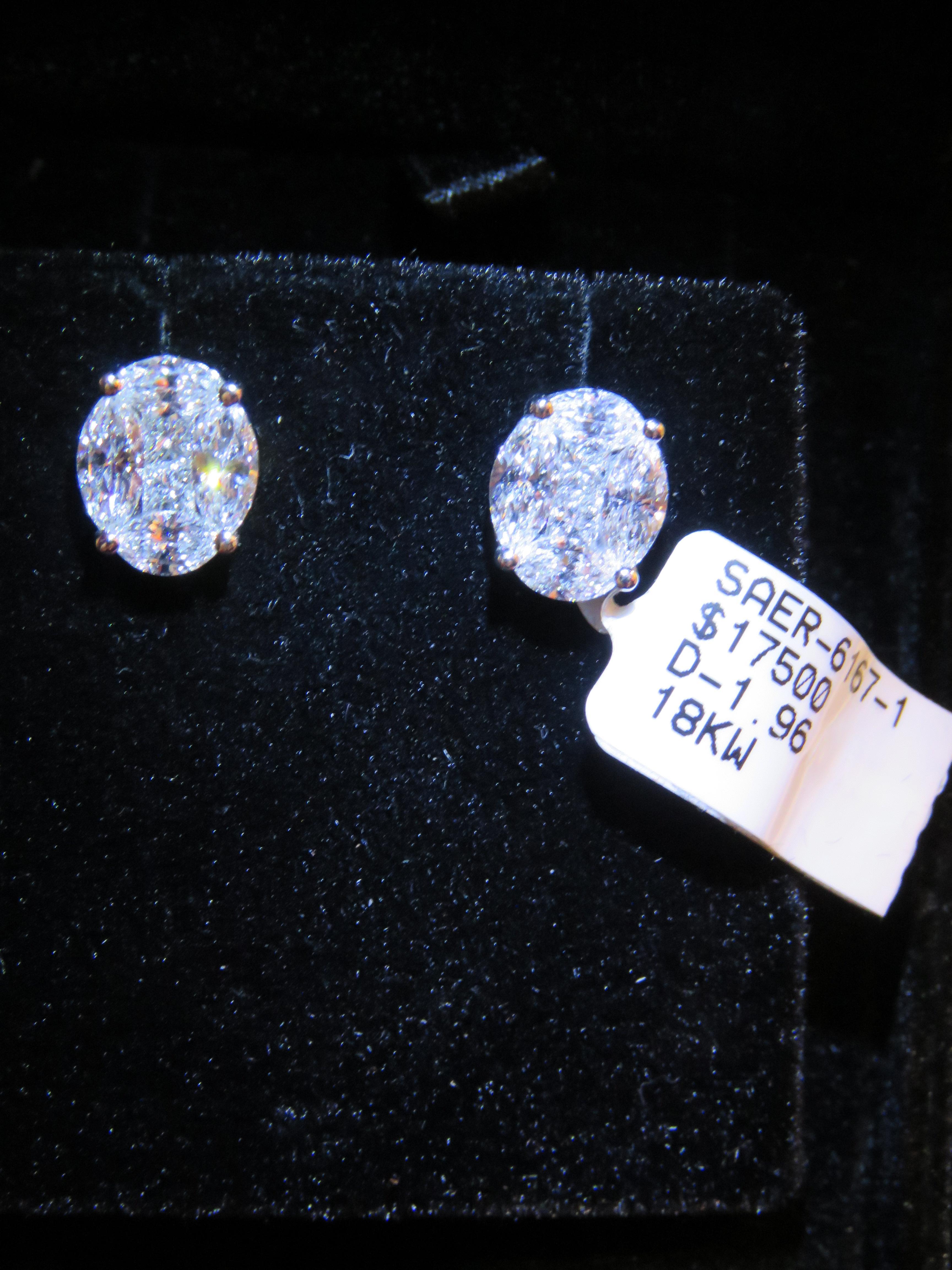 The Following Items we are offering is a Rare Important Radiant 18KT White Gold Stunning Diamond Halo Stud Earrings. Earrings feature Magnificent Rare Sparkling Fine Glittering Trillion Baguette and Round Diamonds!! T.C.W. Approx .65CTS!!! These