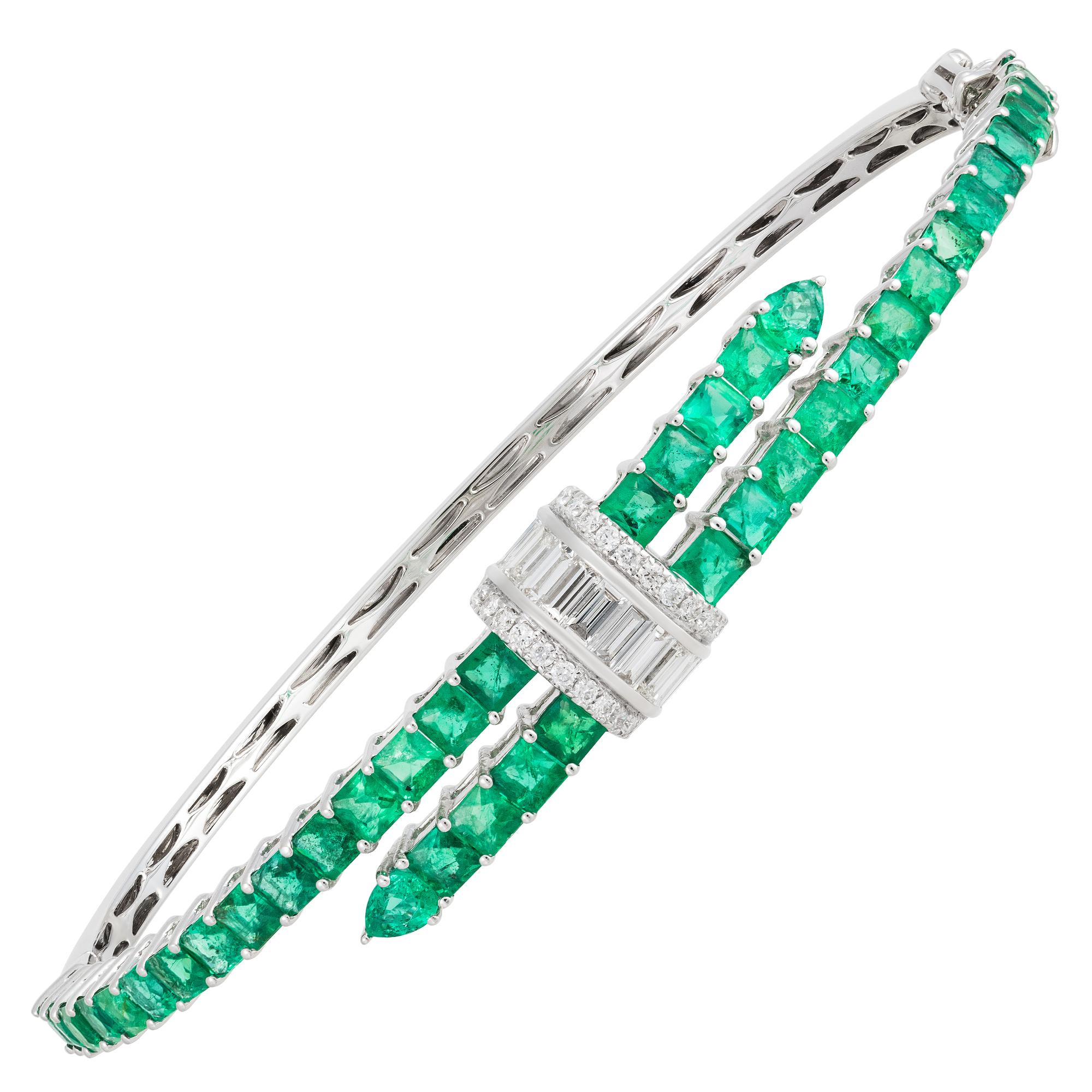 The Following Item we are offering is a Rare Magnificent Radiant 18KT Gold Large Rare Gorgeous Fancy Emerald and Diamond Bangle Bracelet. Bracelet is comprised of Beautiful Glittering Emeralds and adorned with Gorgeous Glittering Diamonds!!! T.C.W.