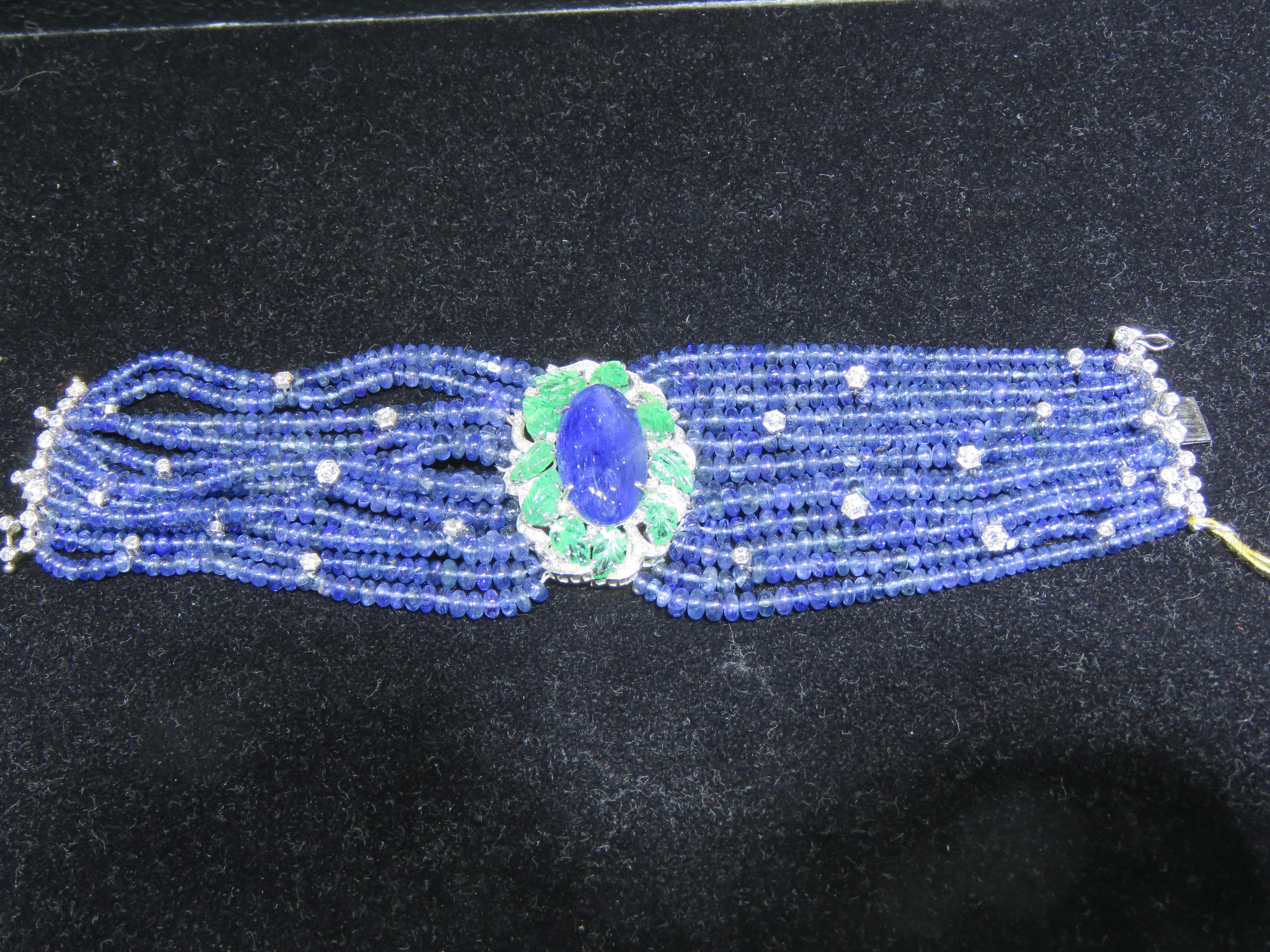 A Rare 18KT White Gold Natural Unheated Burmese Sapphire Diamond Emerald Bracelet. Bracelet is comprised of Finely Set Glittering Gorgeous Natural Burmese Sapphires and adorned with Sparkling Diamonds and Emeralds!! T.C.W. approx 325CTS!!! This