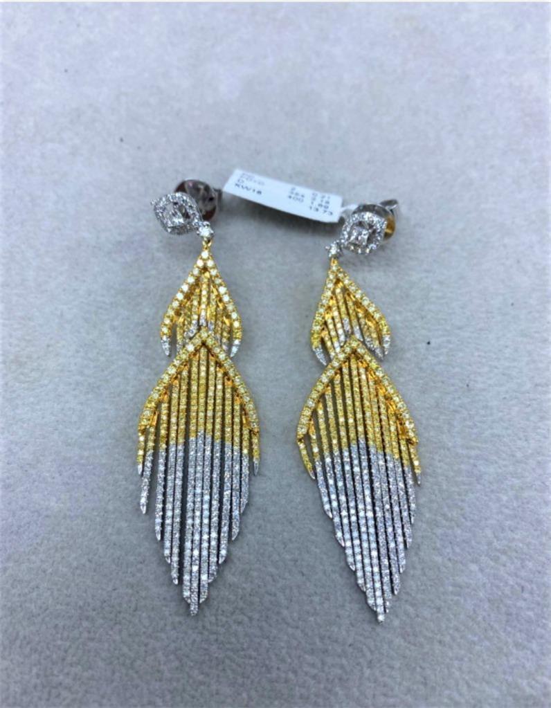 The Following Items we are offering is a Rare Important Radiant 18KT Gold Glamorous and Elaborate Rare Magnificent Glittering Diamond Fringe Design Earrings. Earrings feature Rare Sparkling Fine Glittering Fancy Yellow and White Diamonds set in 18KT