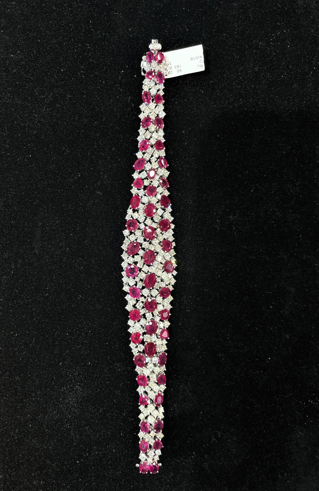 The Following Item we are offering is this Rare Important Radiant 18KT Gold Gorgeous Glittering and Sparkling Magnificent Fancy Rare Burmese Ruby and Diamond Bracelet. Bracelet contains approx 40CTS of Beautiful Fancy Burmese Rubies and Diamonds!!!