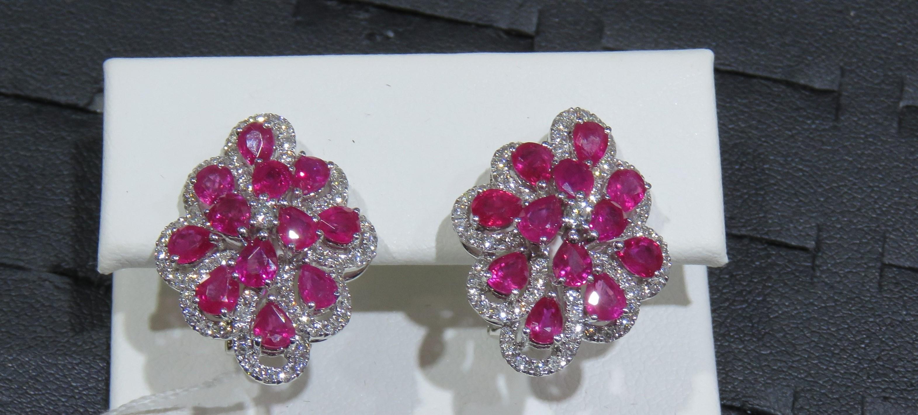 The Following Items we are offering is this Rare Important Radiant 18KT Gold Gorgeous Glittering and Sparkling Magnificent Fancy Ruby Diamond Earrings. Earrings contain approx 7CTS of Beautiful Fancy Rubies and Diamonds!!! Stones are Very Clean and