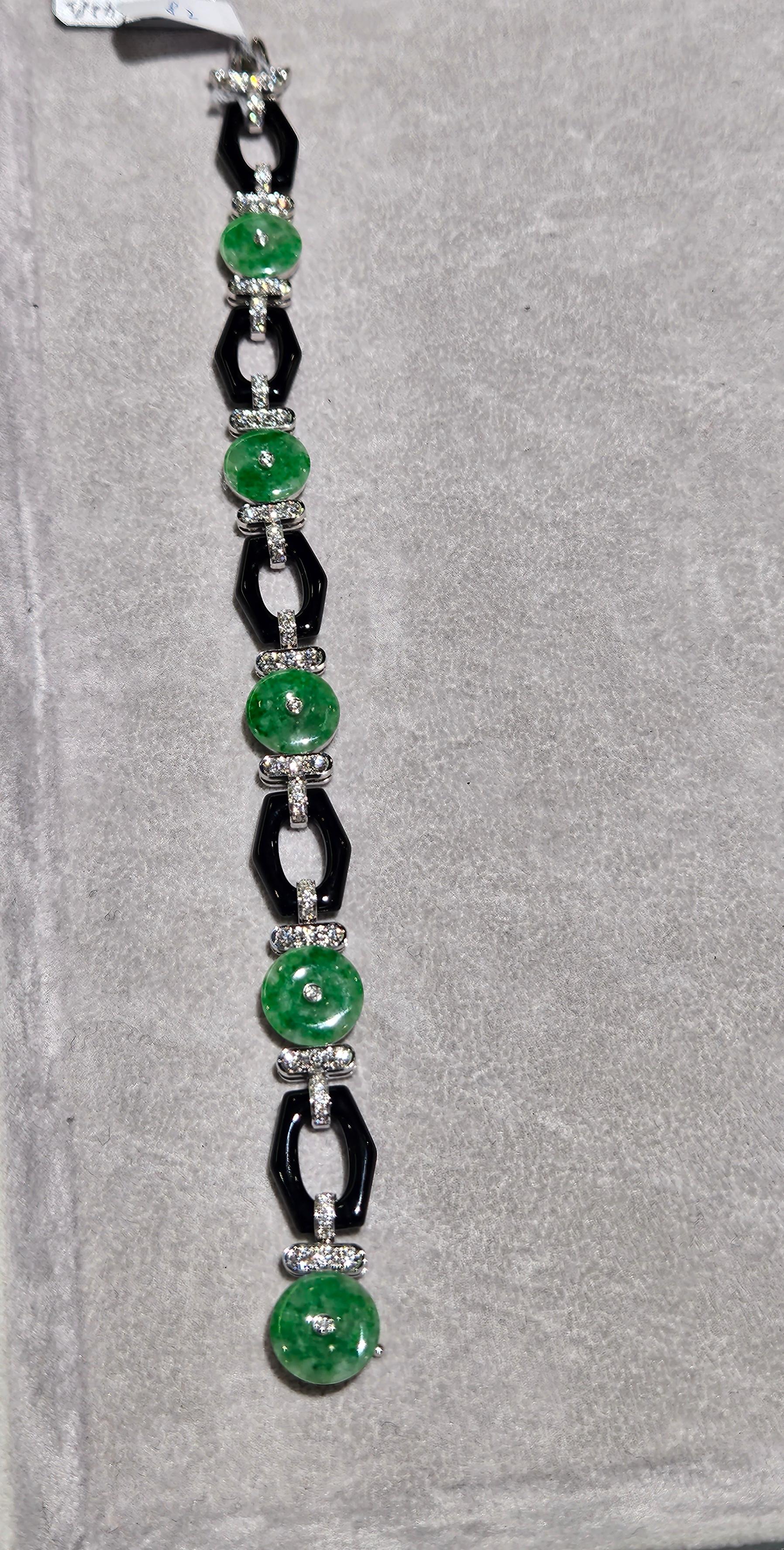 The Following Item we are offering is a Rare Magnificent Radiant 18KT Gold Large Rare Gorgeous Fancy Burmese Jade Diamond Bracelet. Bracelet is comprised of Beautiful Rare Burmese Jade and Glittering Diamonds and Black Onyx. T.C.W. Approx 2CTS of